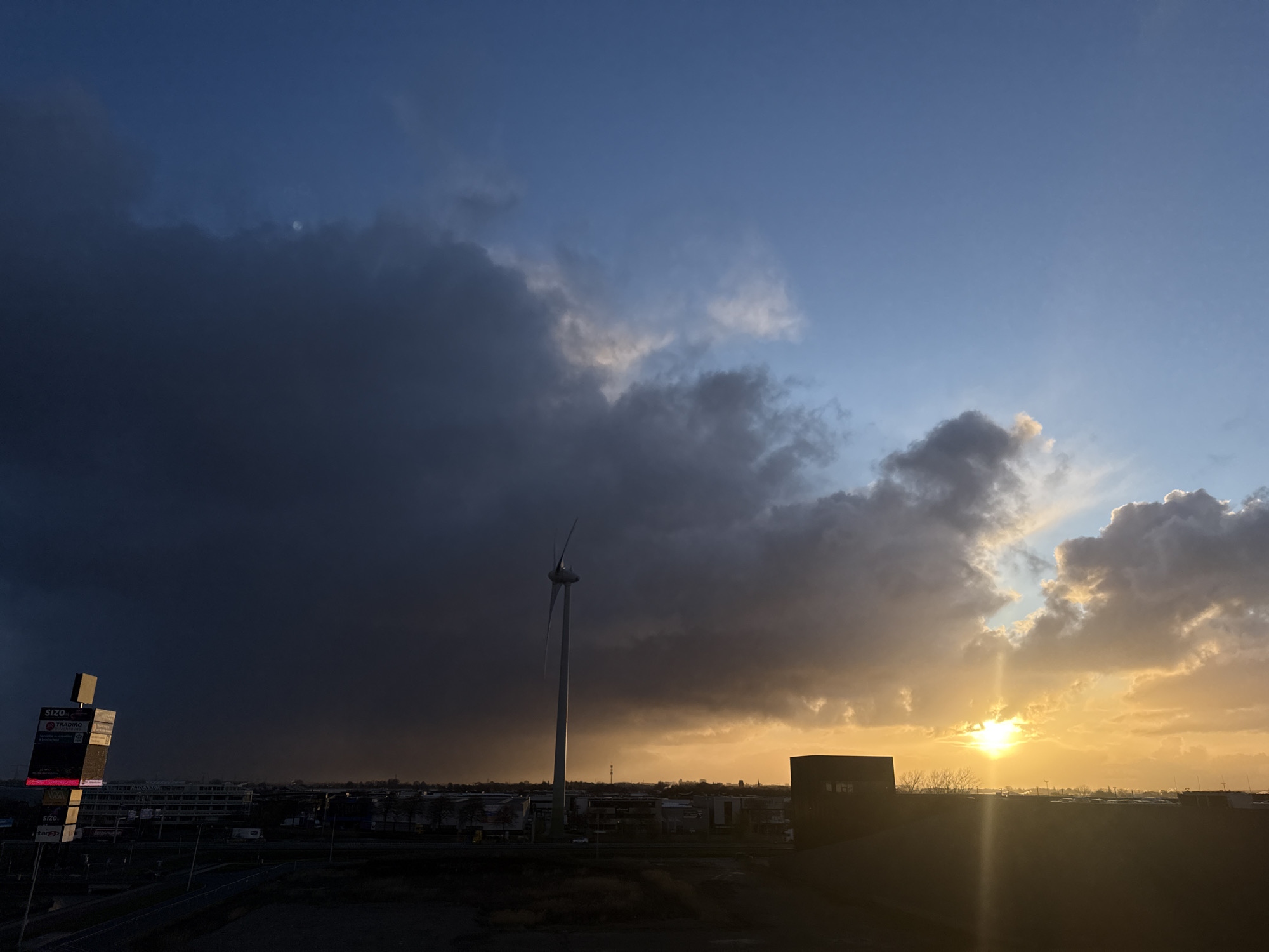 Dramatic sunset skies captured across Dutch industrial landscape