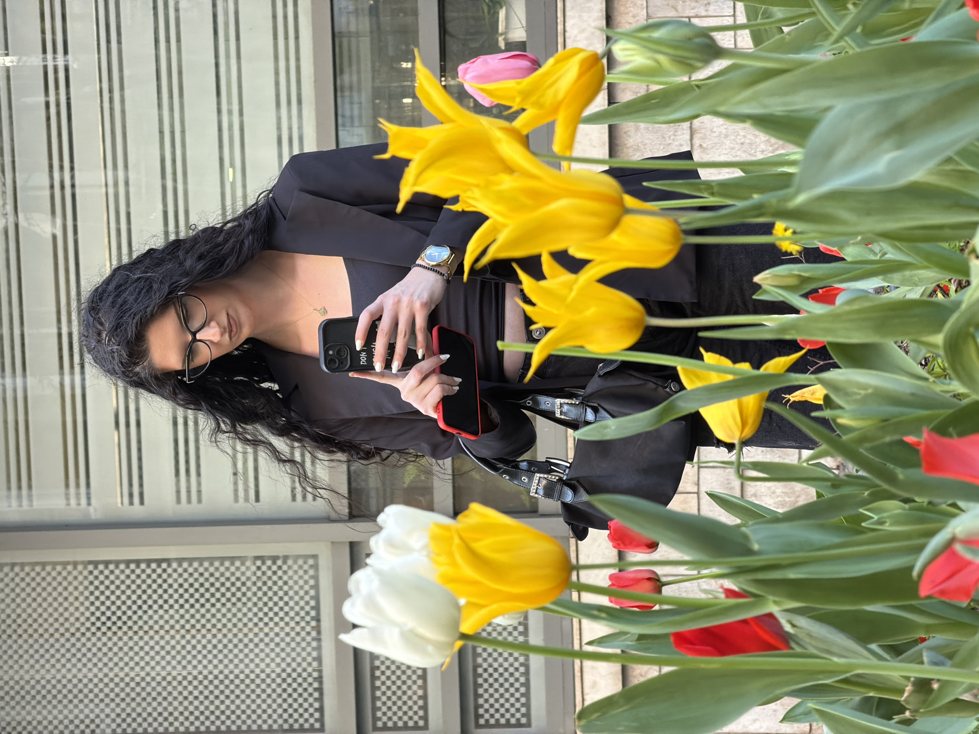 Woman in business attire spotted near tulips in Belgrade
