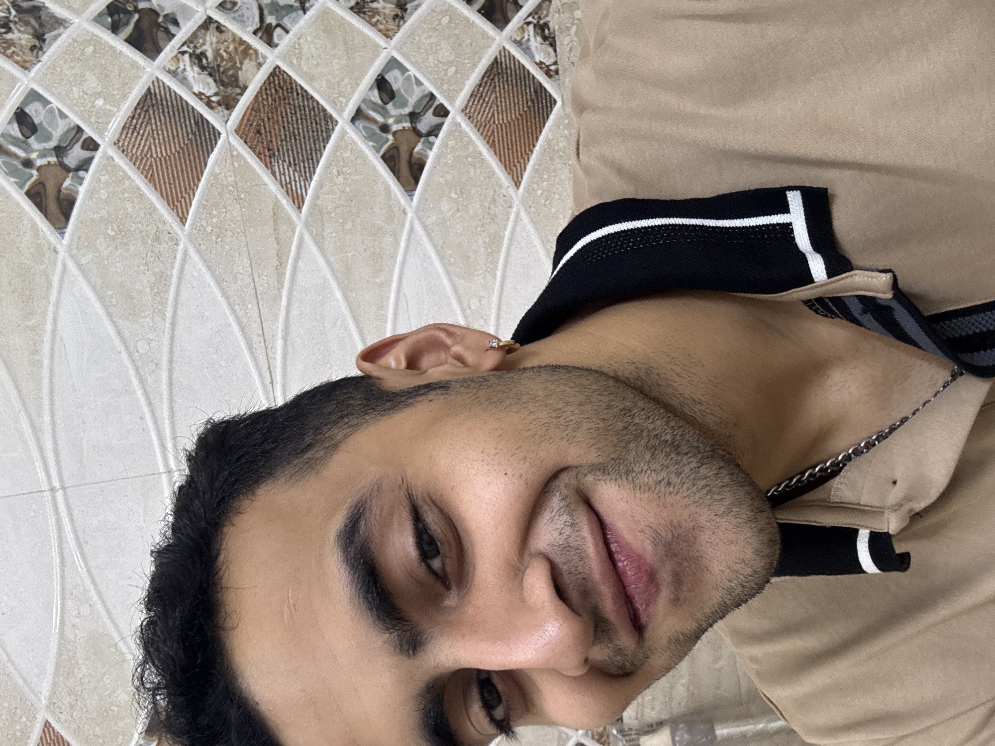 Portrait of bearded man in light brown shirt captured in Kolkata