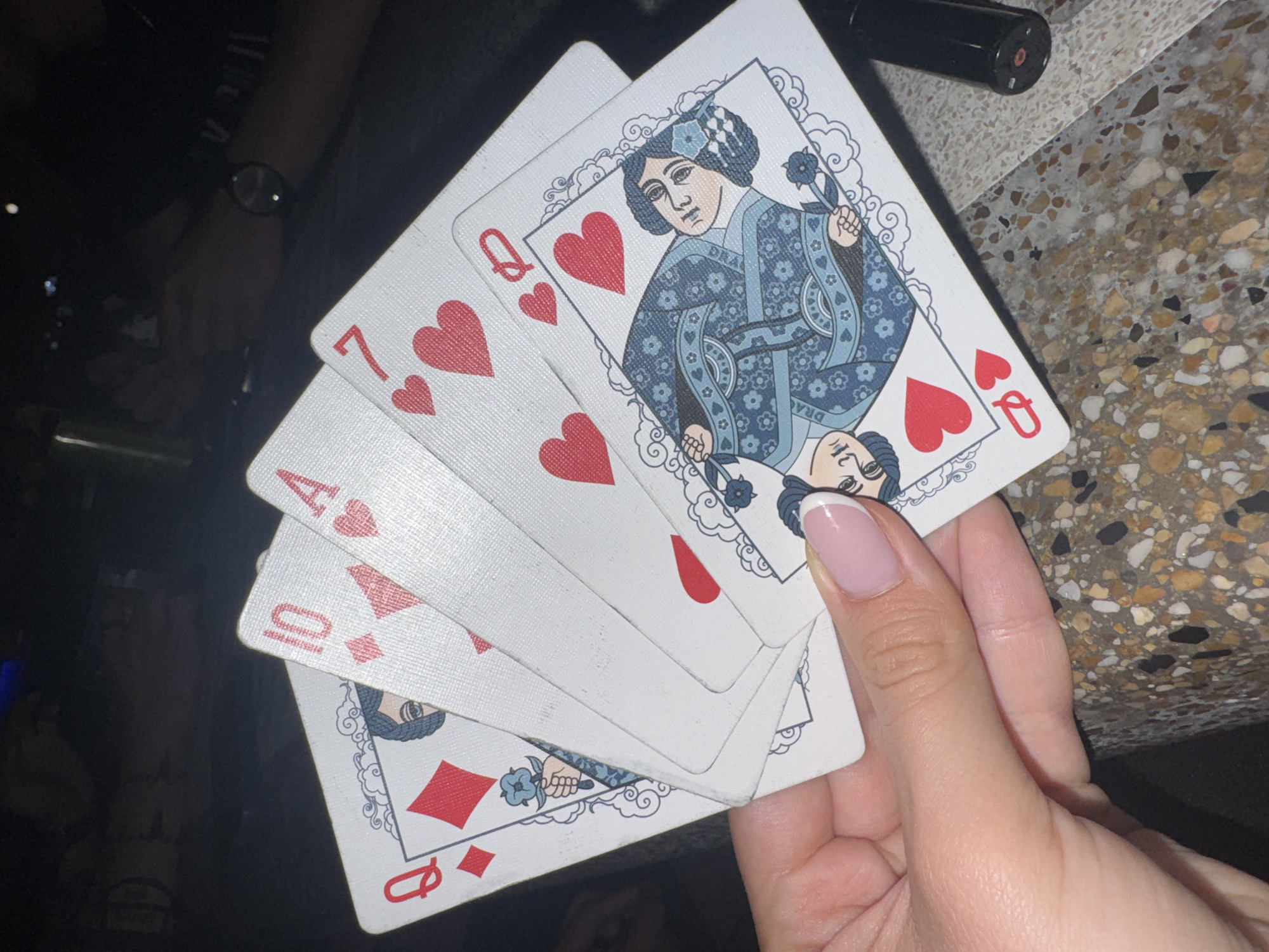 Late-night card game in a Ruse park, summer evening.