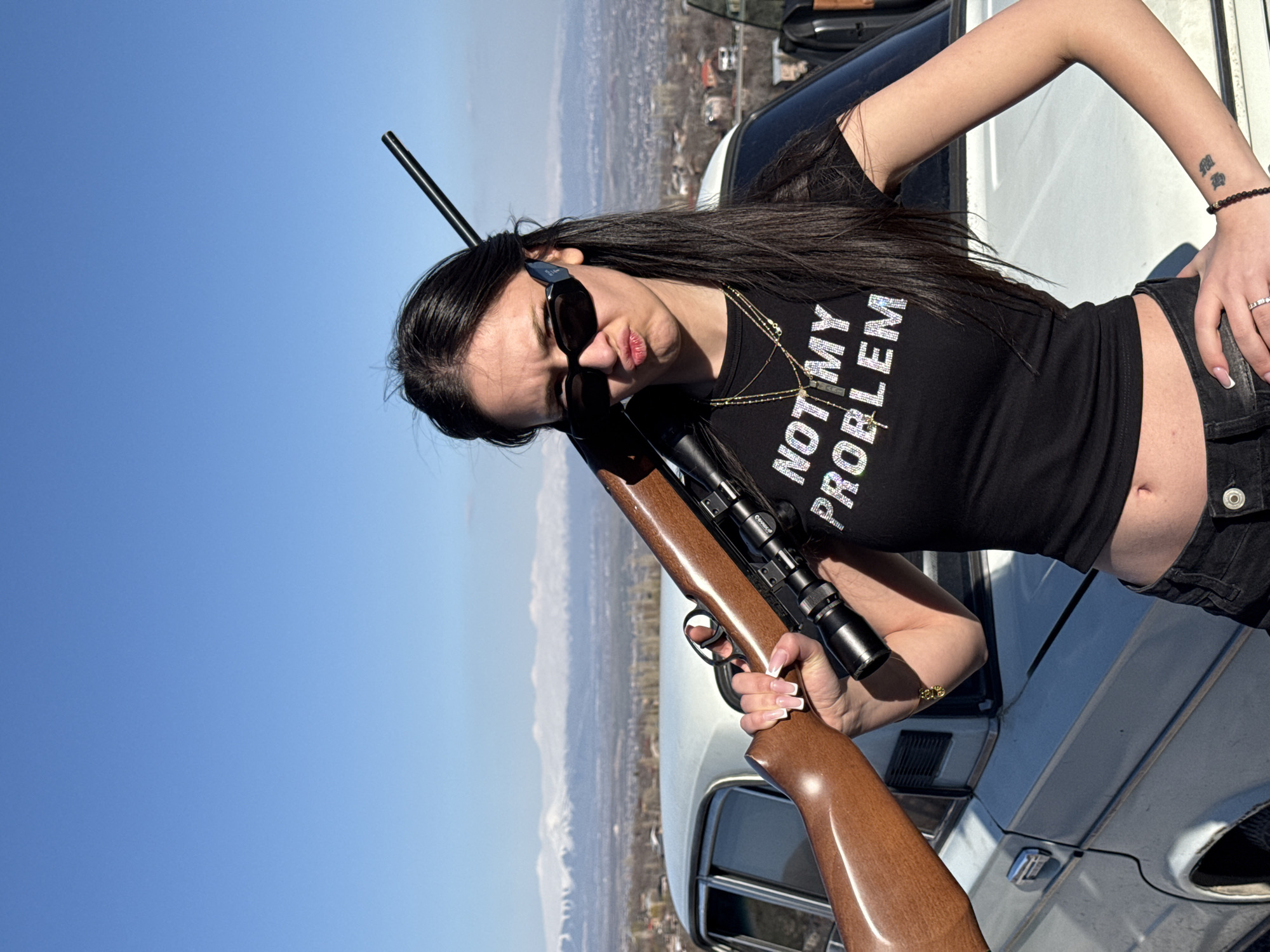Woman photographed with rifle, dog in Byurakan Armenia
