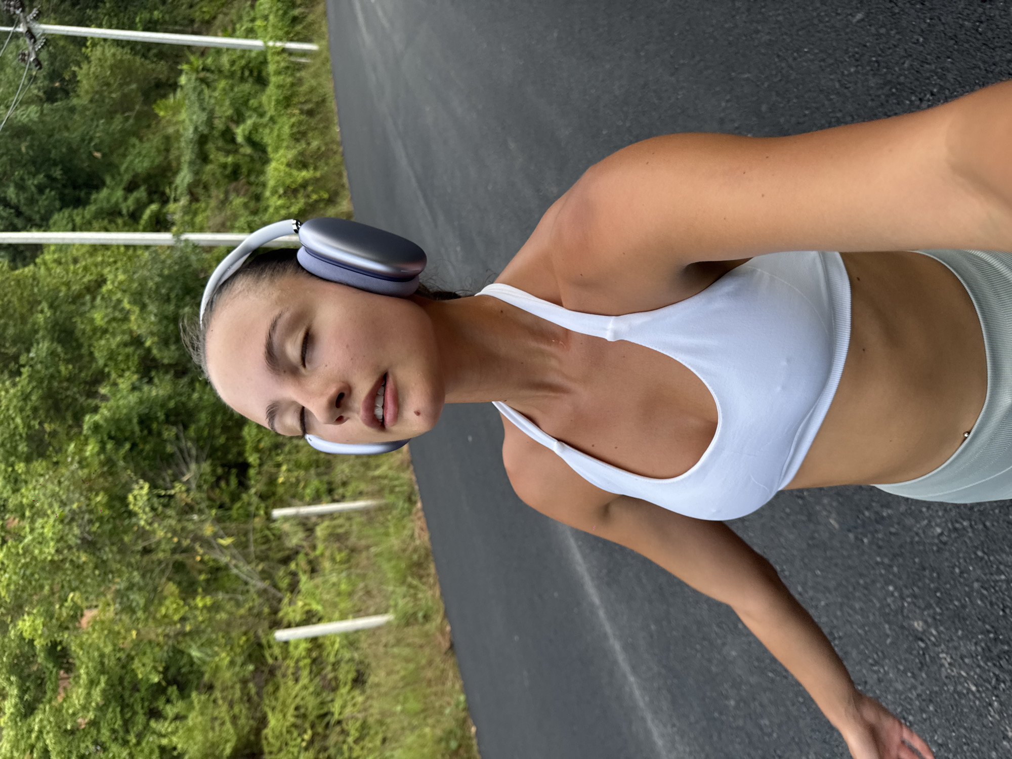 Woman takes selfie during walk on Chalong road