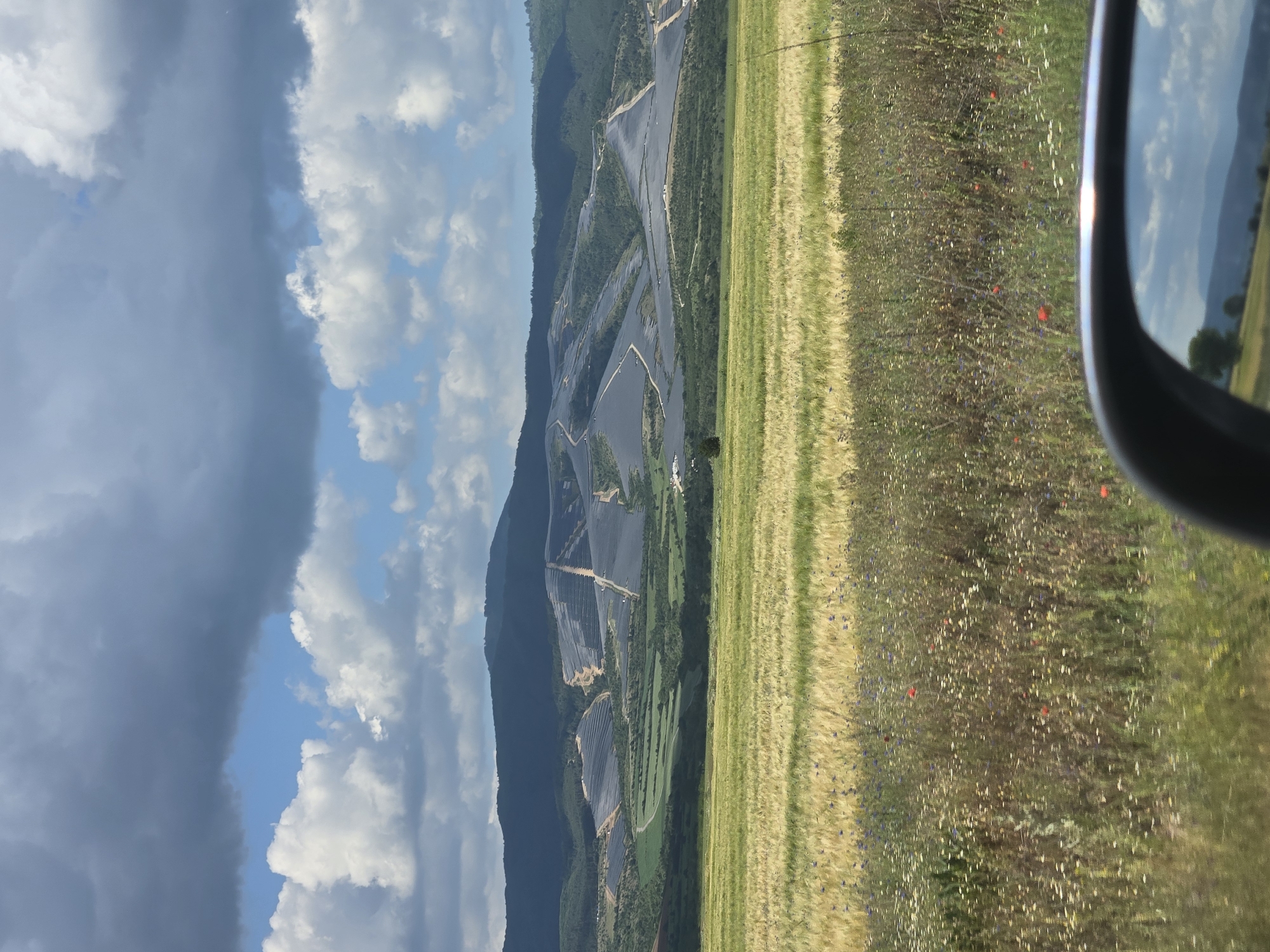 Rural road journey documented through countryside with solar panels