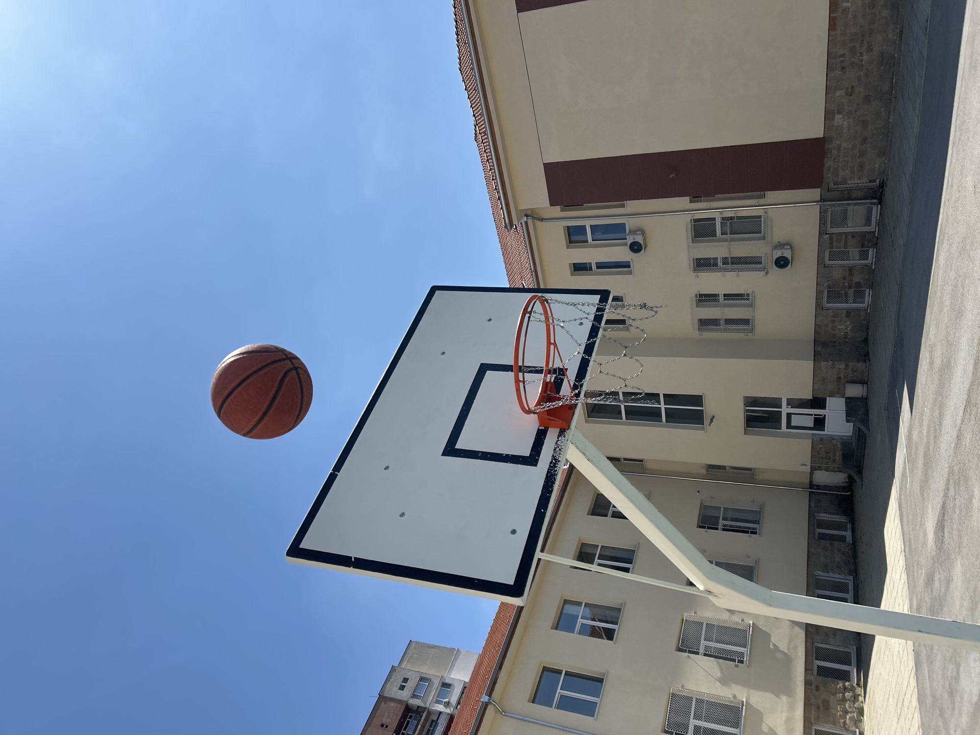 Basketball captured mid-air near hoop in Sofia