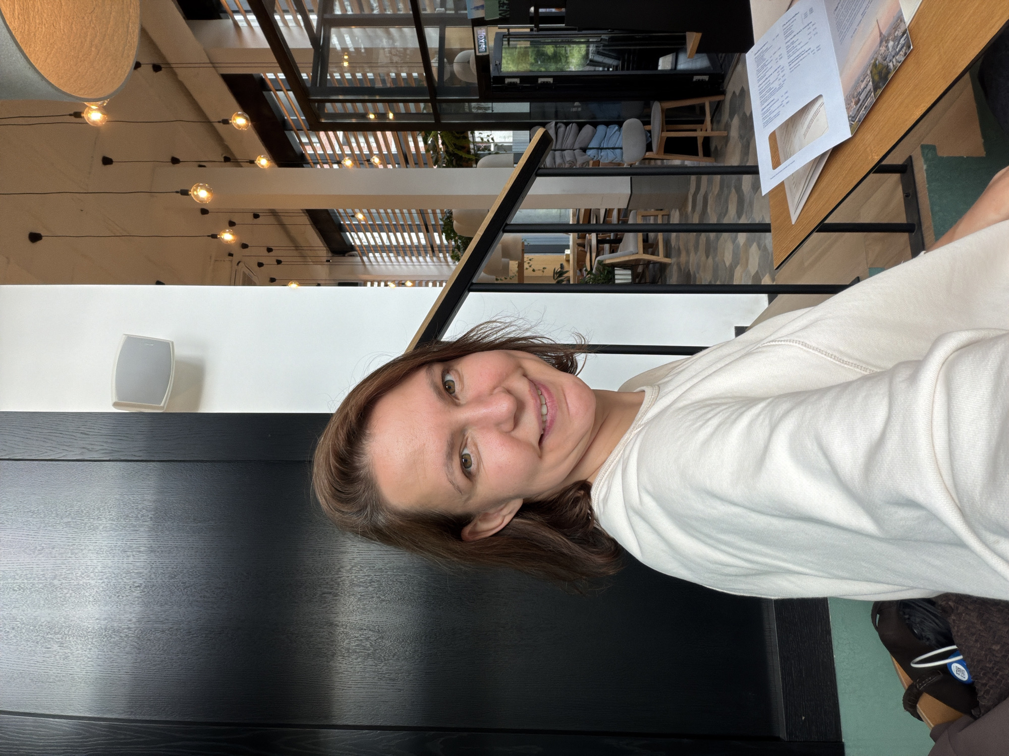 Woman dines at modern cafe in Izhevsk city center