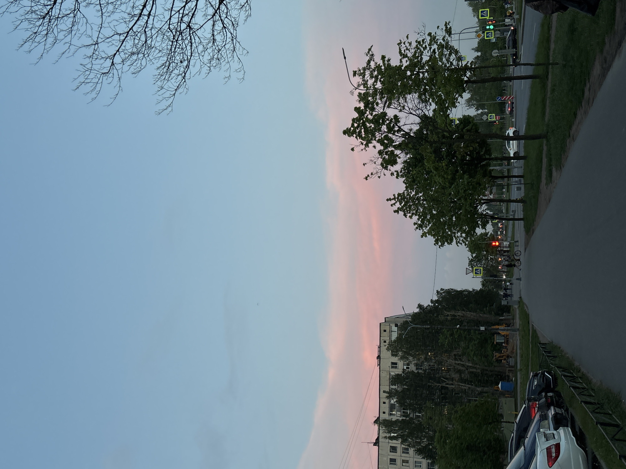 Evening street life captured in Vsevolozhsk during spring twilight