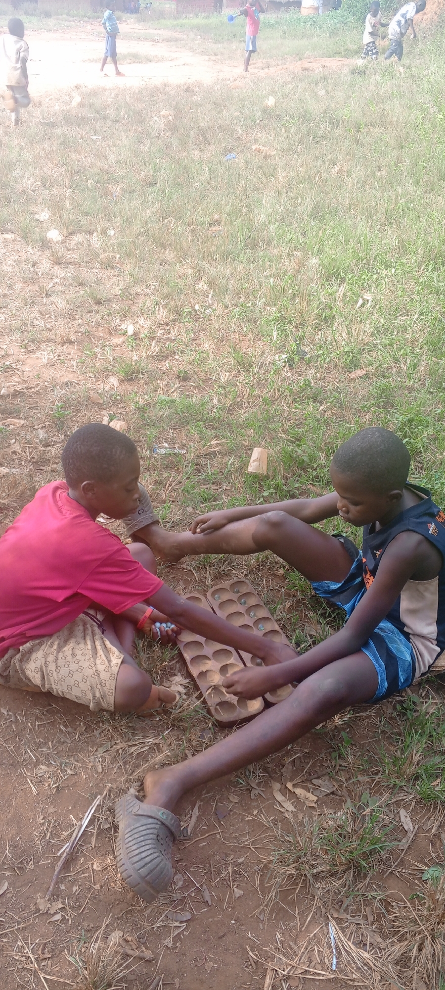 Children play traditional games in Ngalula, DR Congo
