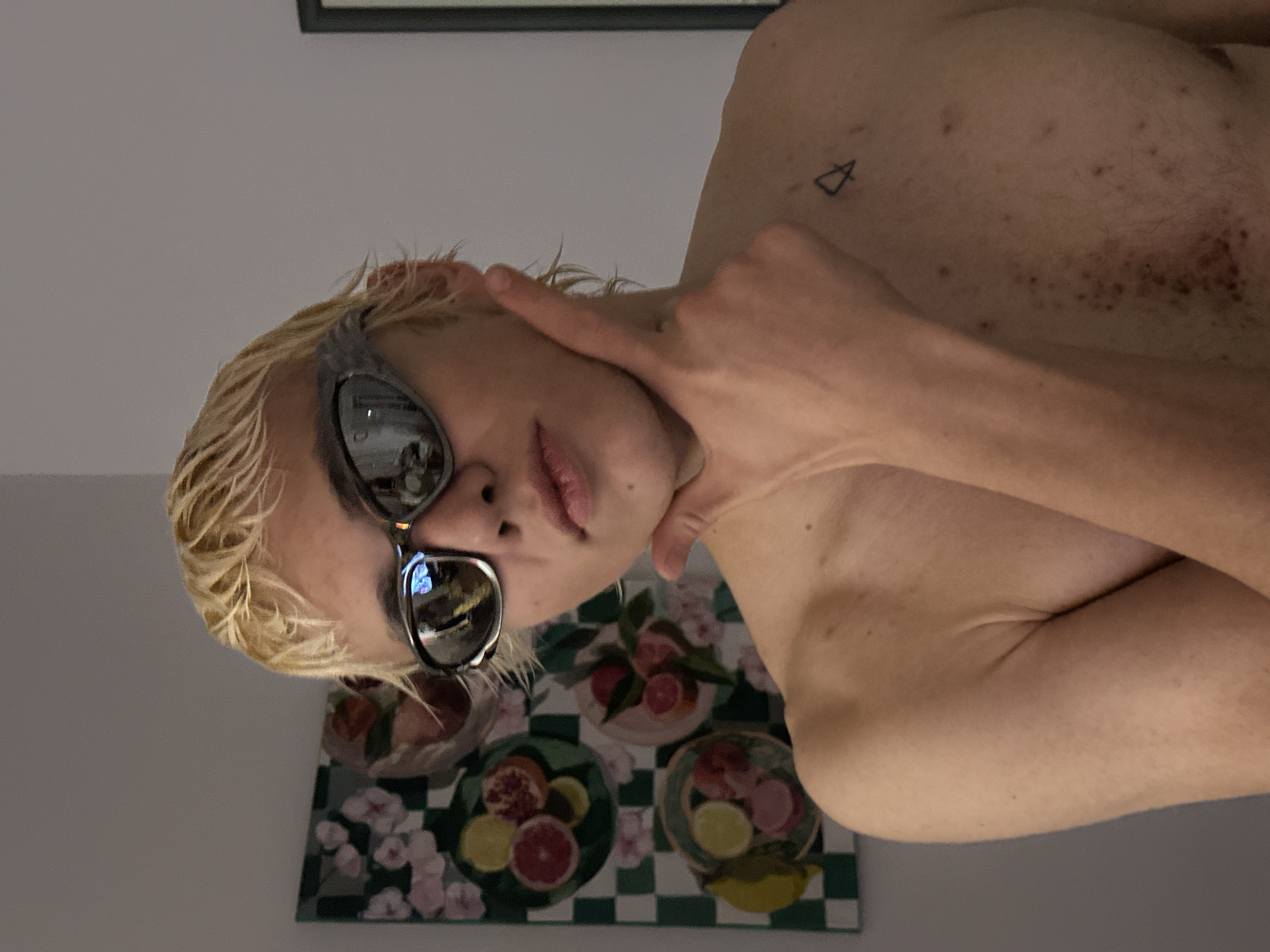Blonde individual photographed posing shirtless in Novi Sad