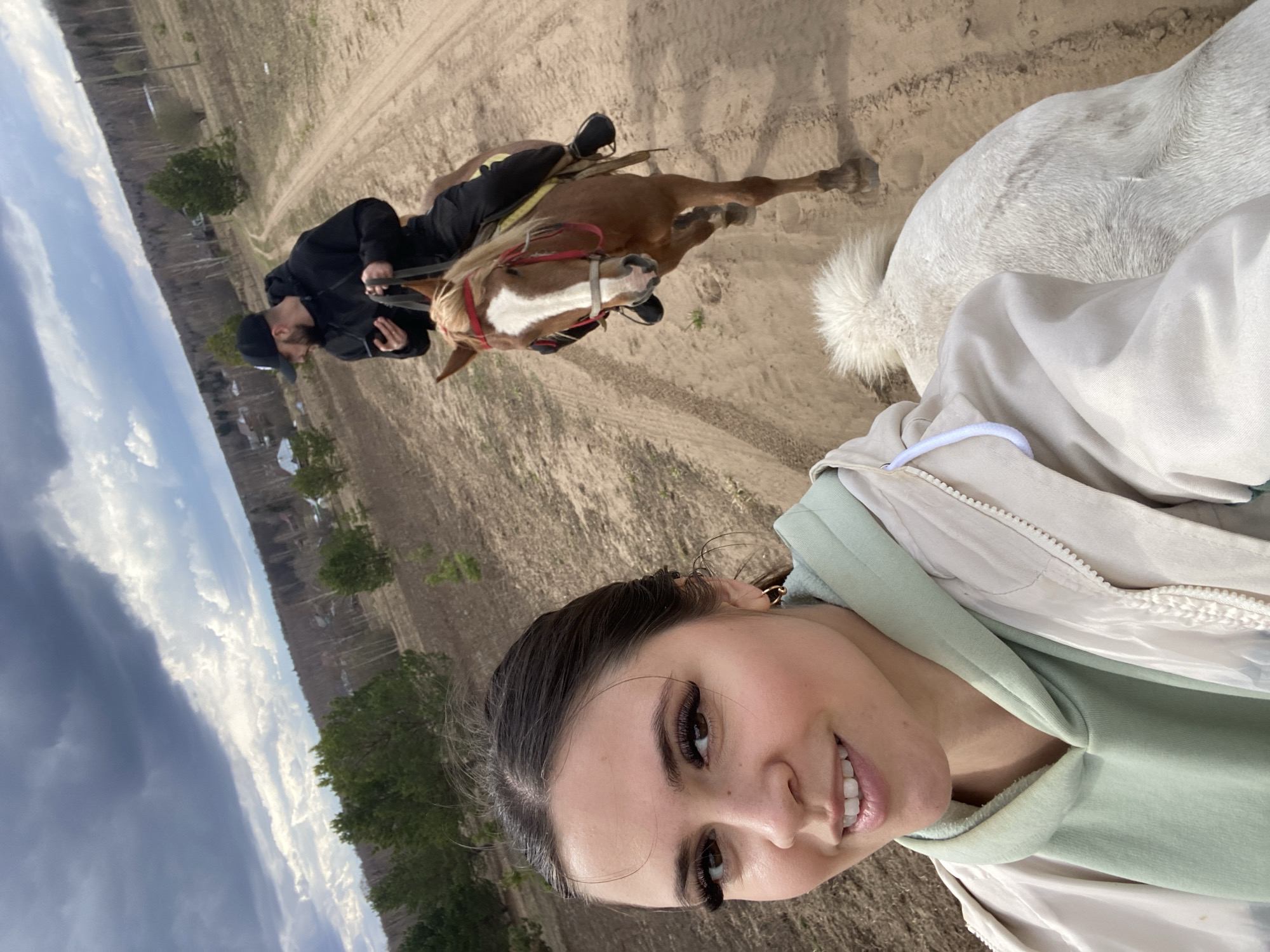 Horseback riders documented during morning trail ride in rural Russia
