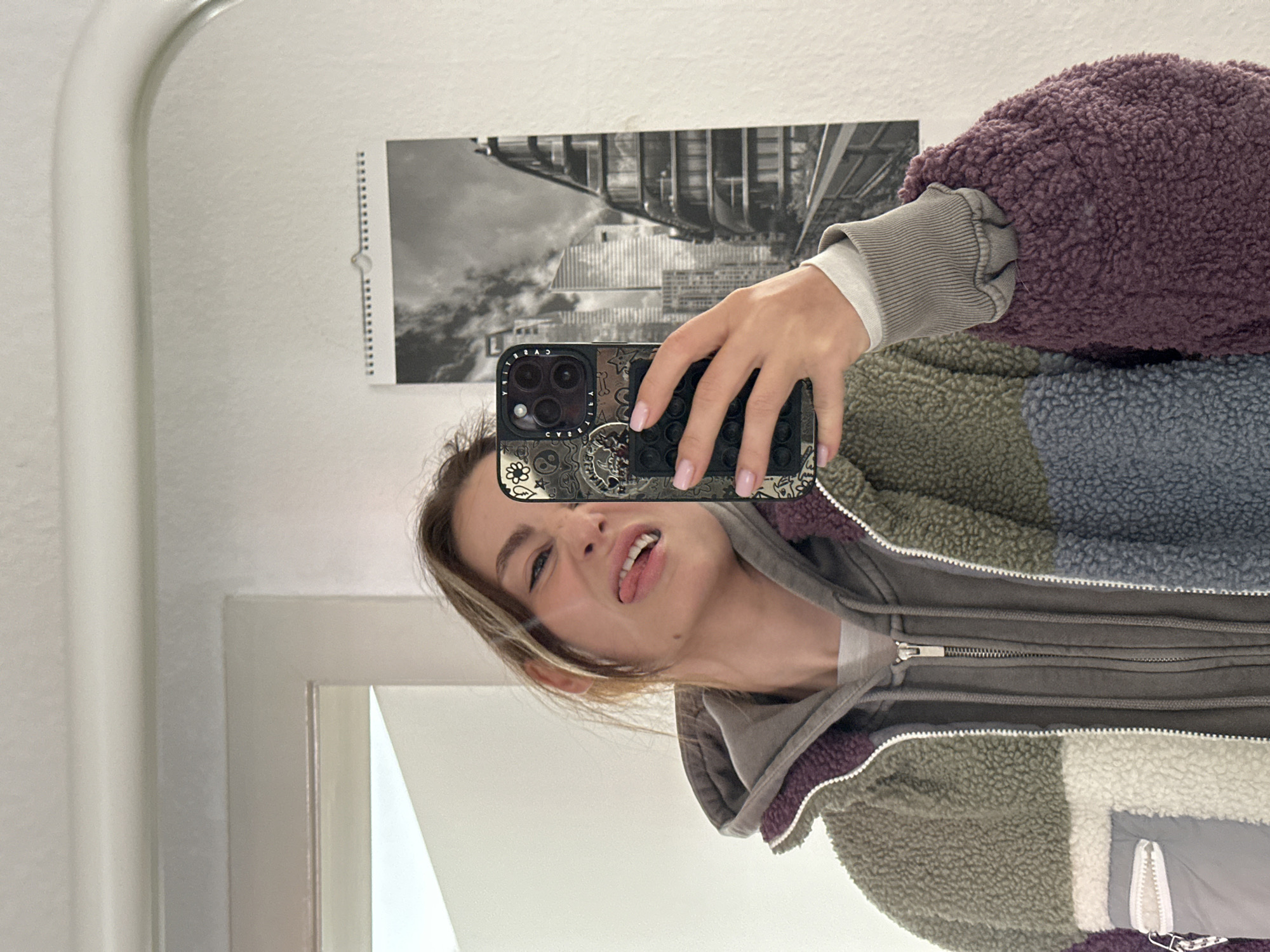Young woman takes morning selfies in Kiel elevator