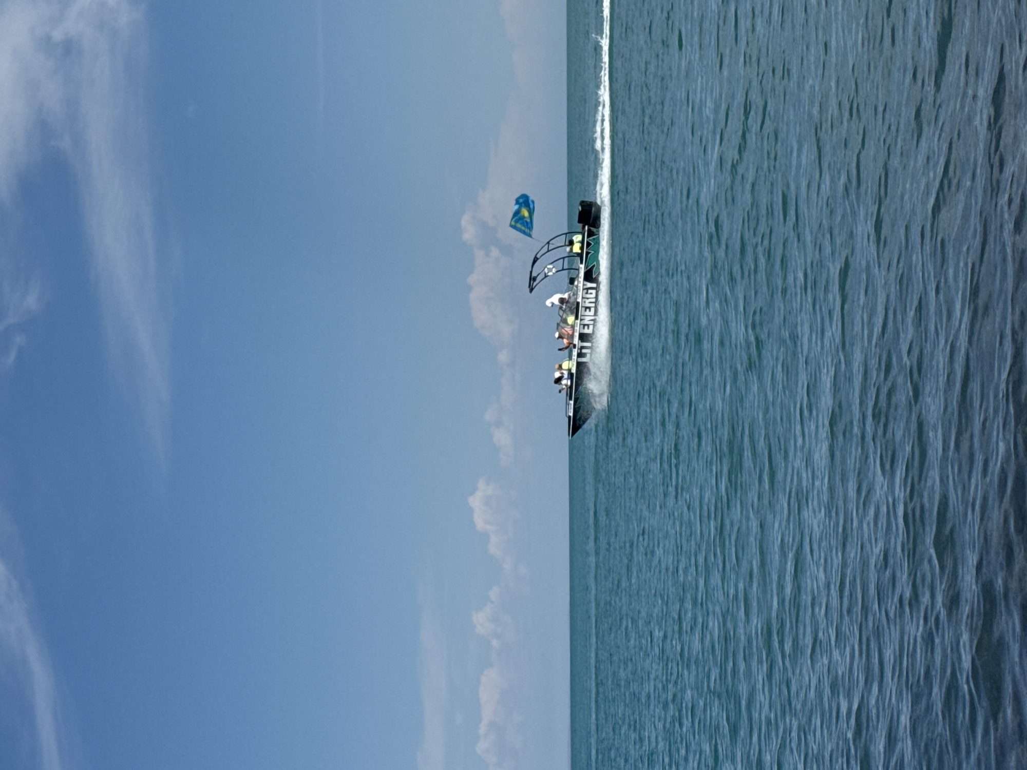Caspian shoreline hangout with boats and fried snacks, Ақші