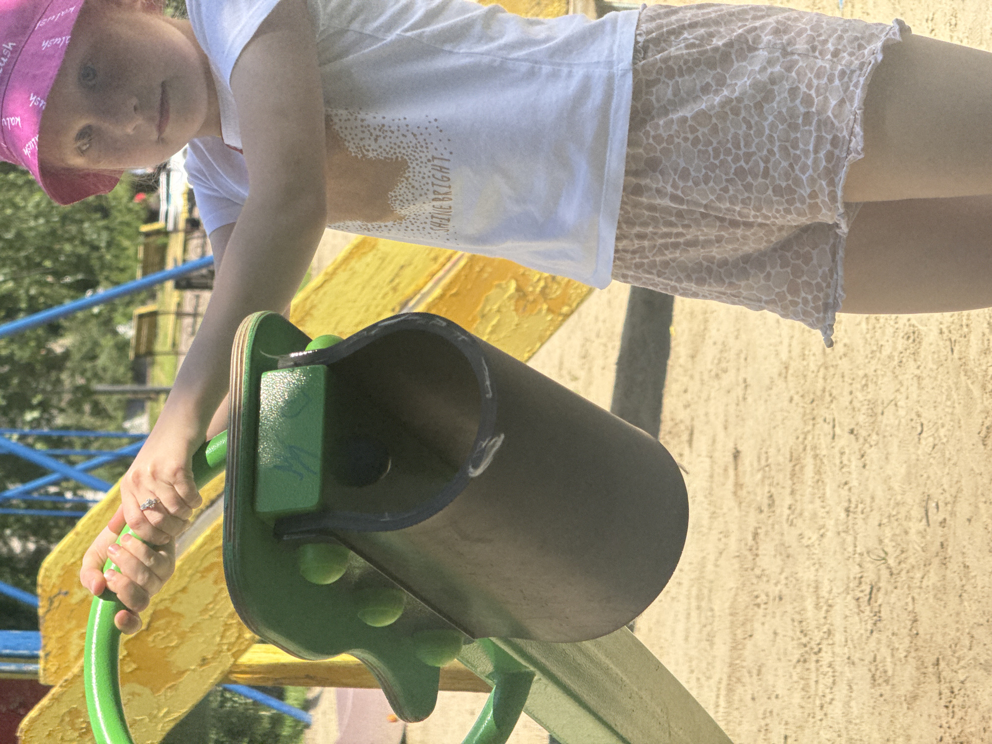 Children play at Poltava playground during sunny afternoon