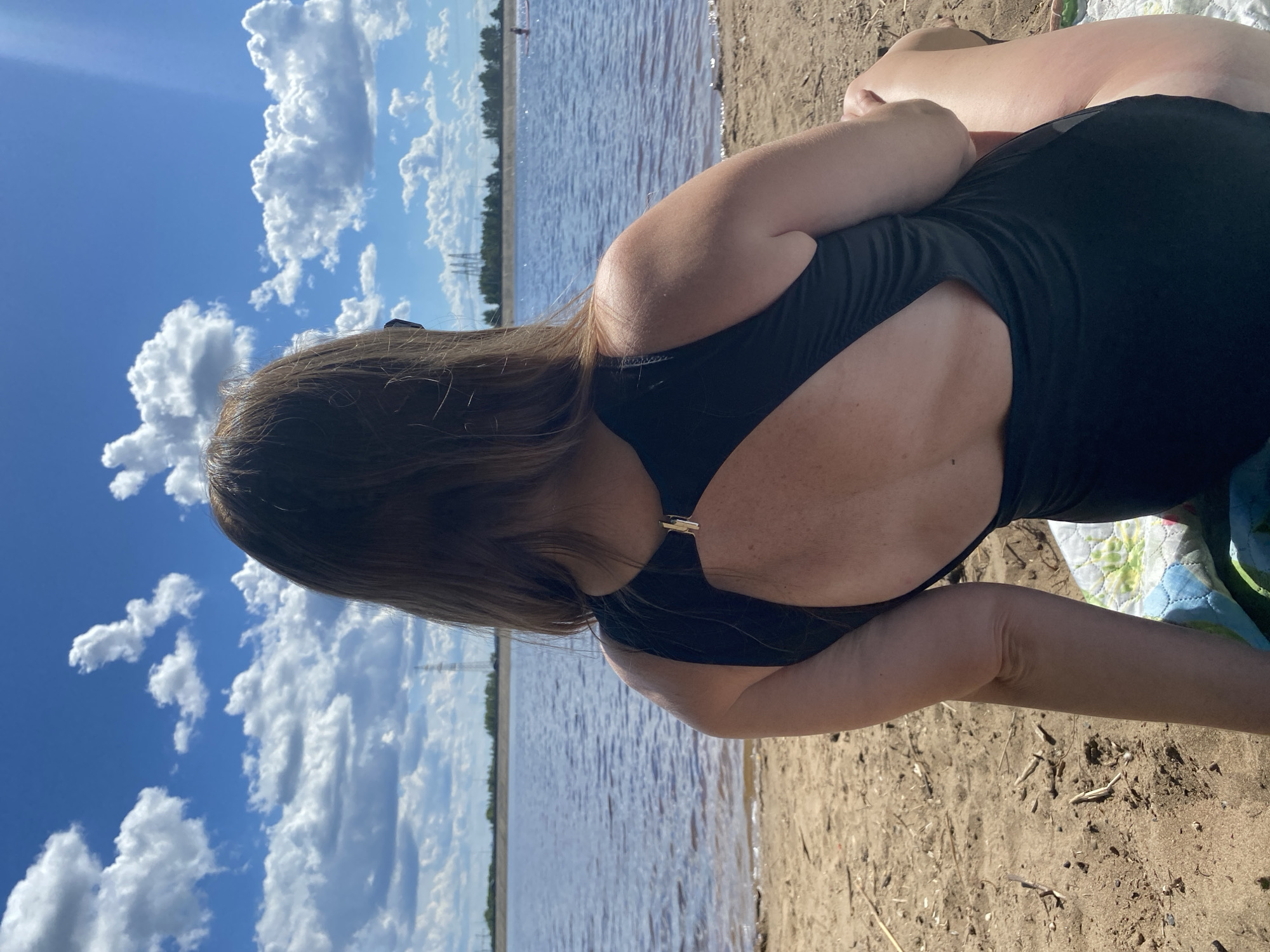Summer beach day on the water in Noviy, Russia