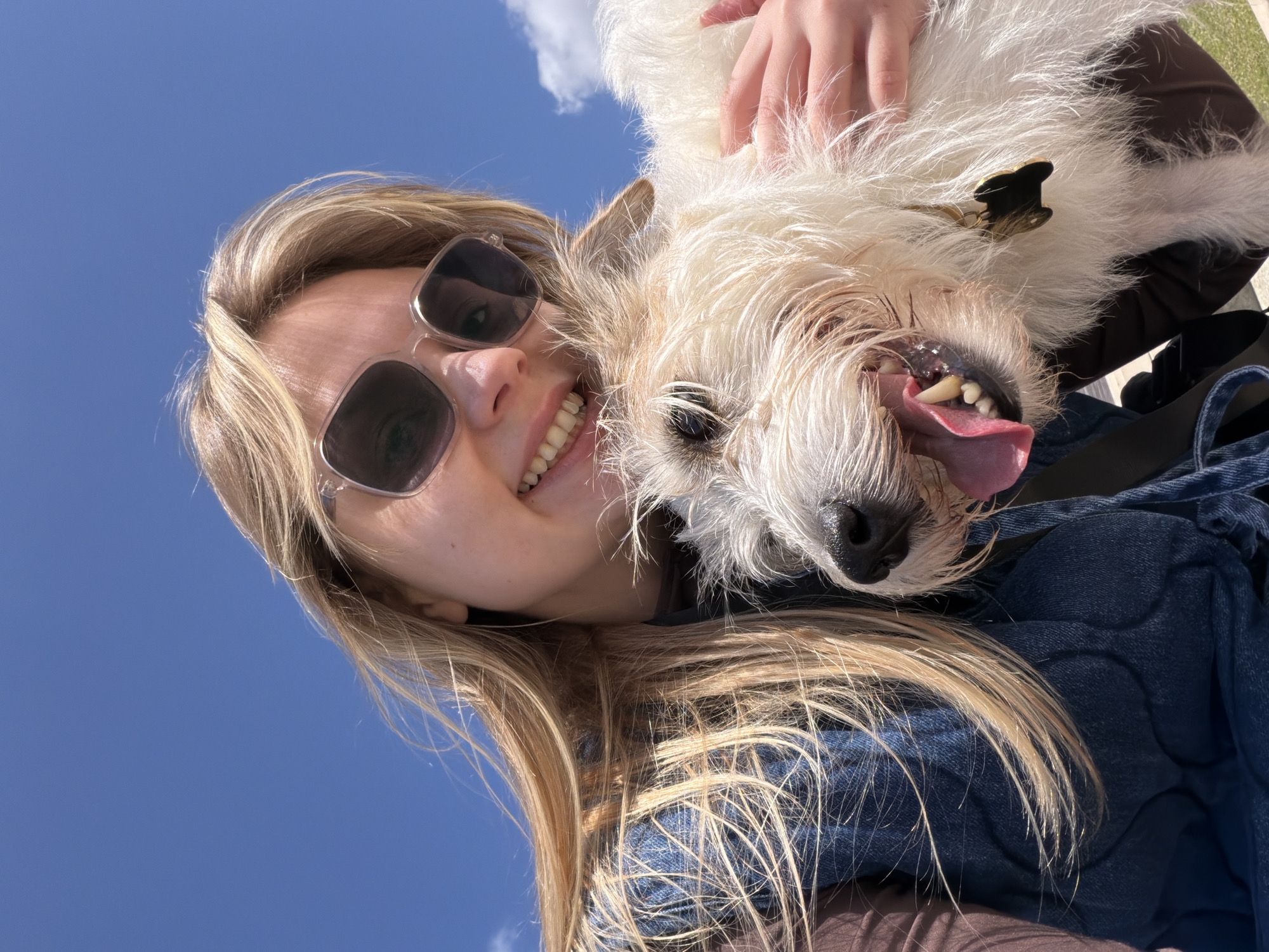 Woman and dog enjoy sunny day at Tel Aviv beach