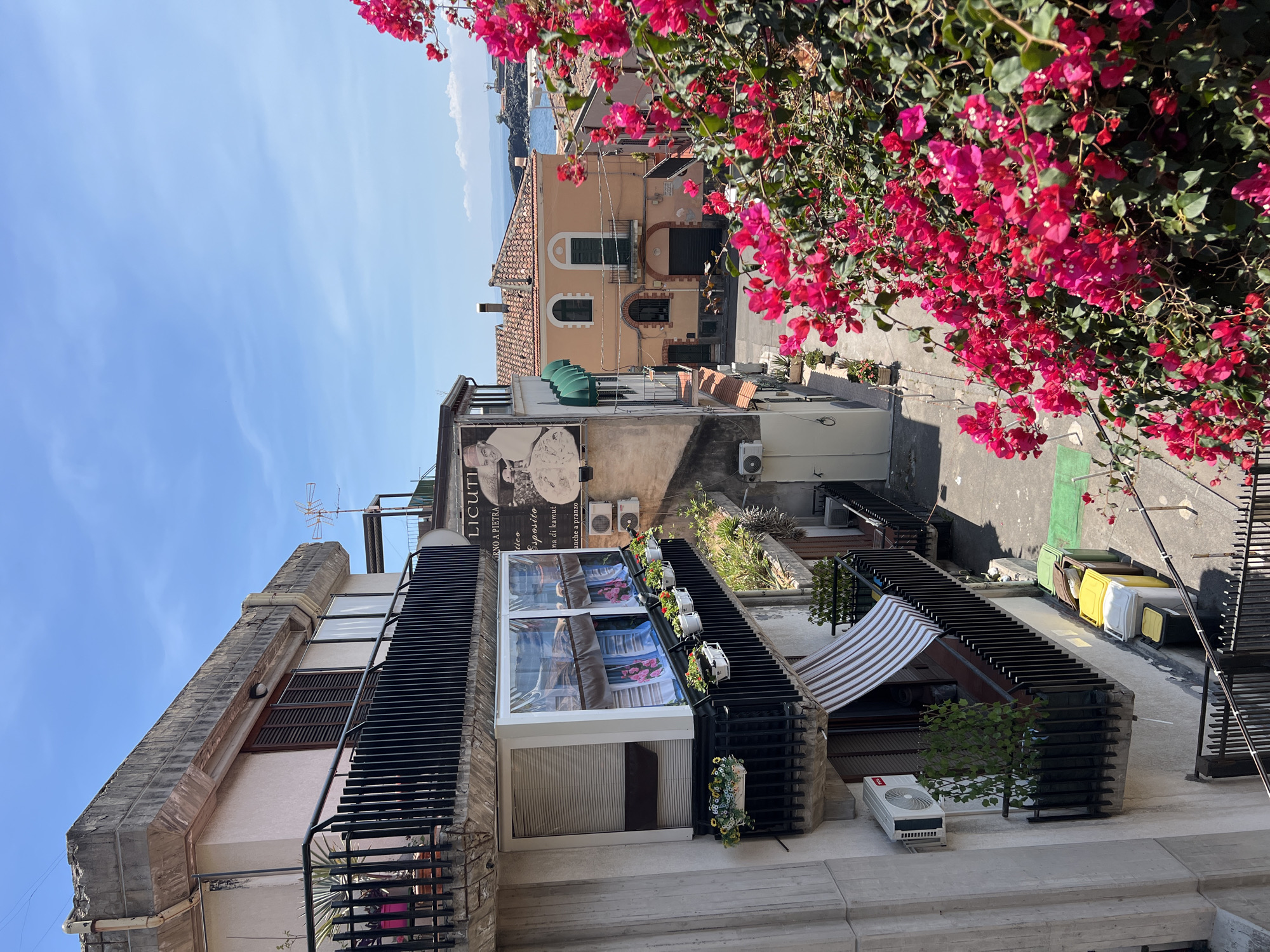 Rooftop views over Catania's streets and the Sicilian coast
