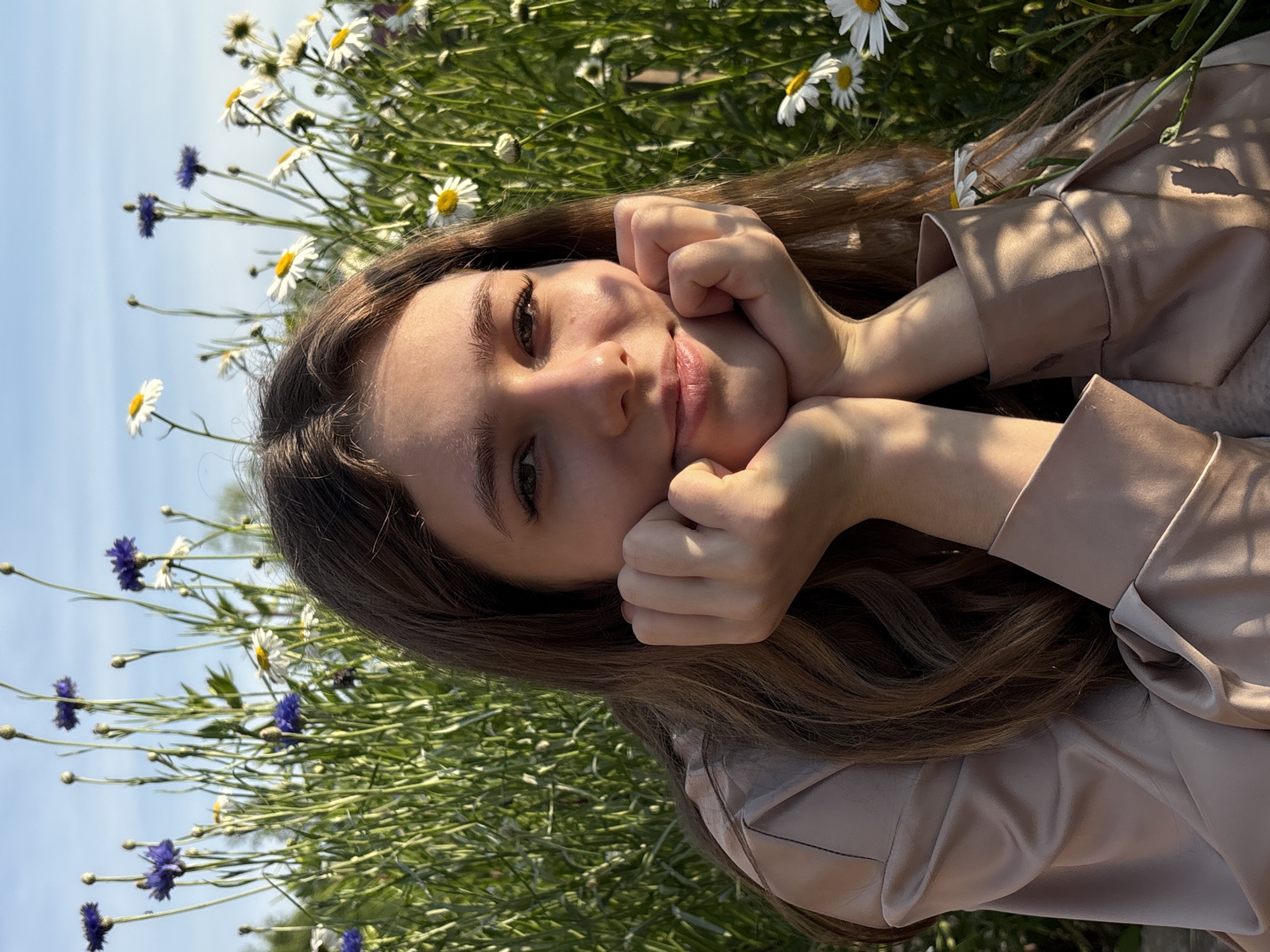 Summer day in a Razdolnoye garden with peonies and a Pomeranian