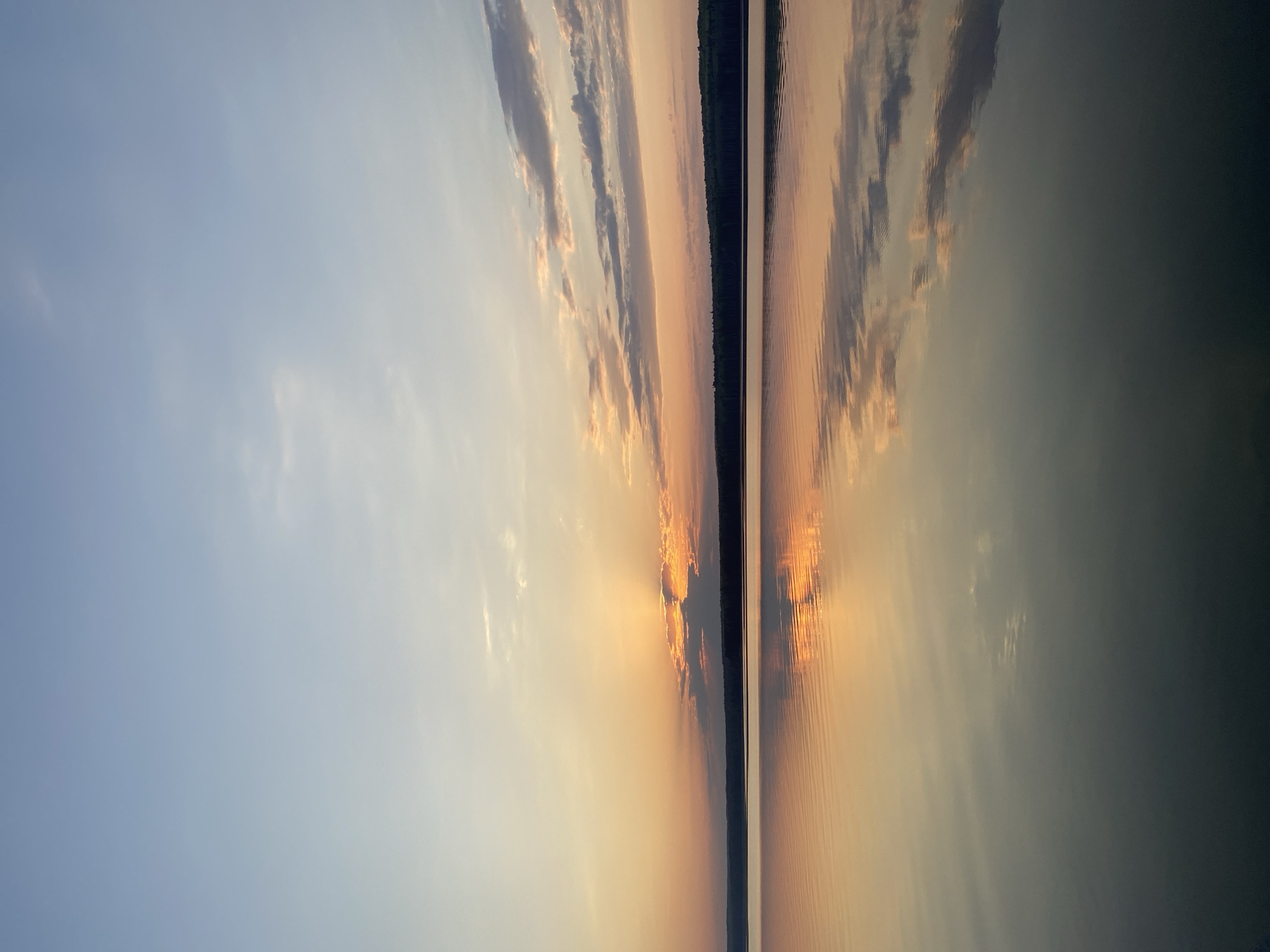 Sunset witnessed over water in Chaikovsky, Russia