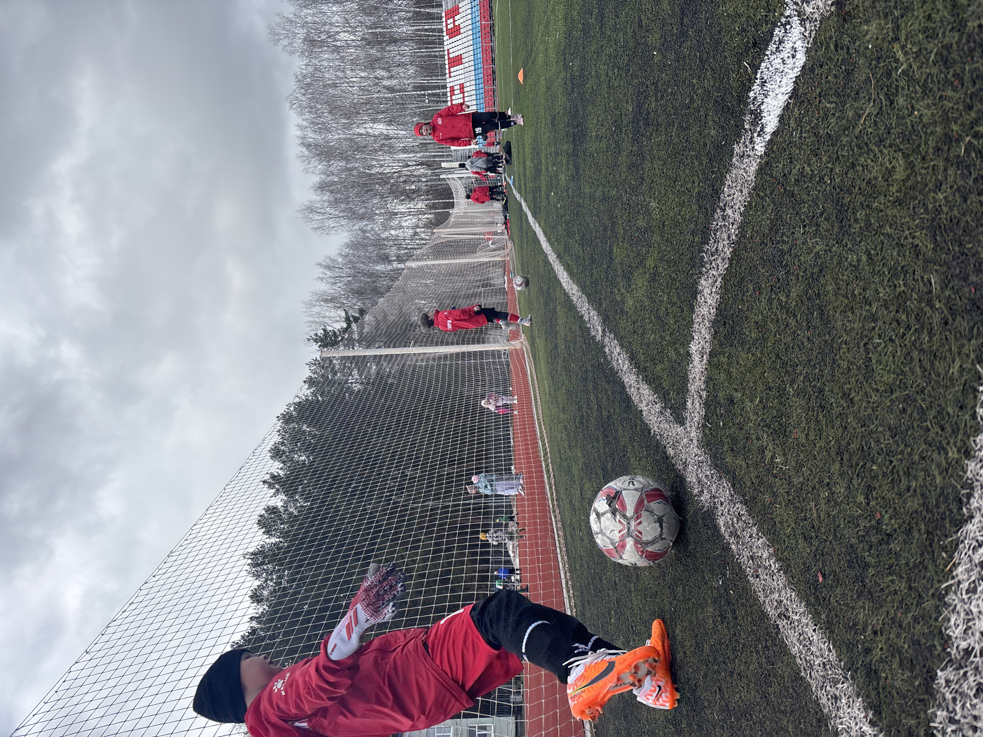 Early morning soccer practice session at Chaikovsky Central Stadium