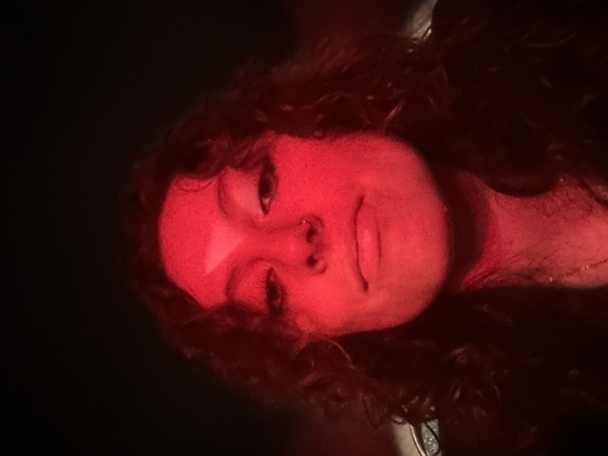 Red-lit portrait captured in Mexico City early morning