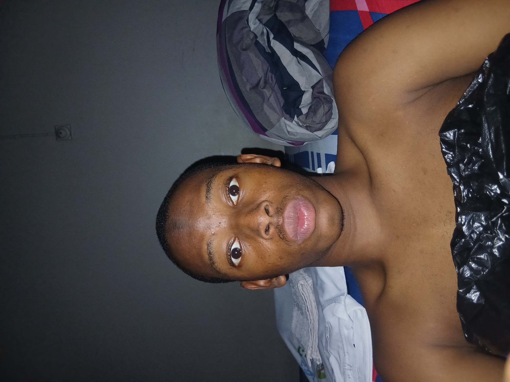 Casual bedroom selfie session in Lagos, Nigeria.