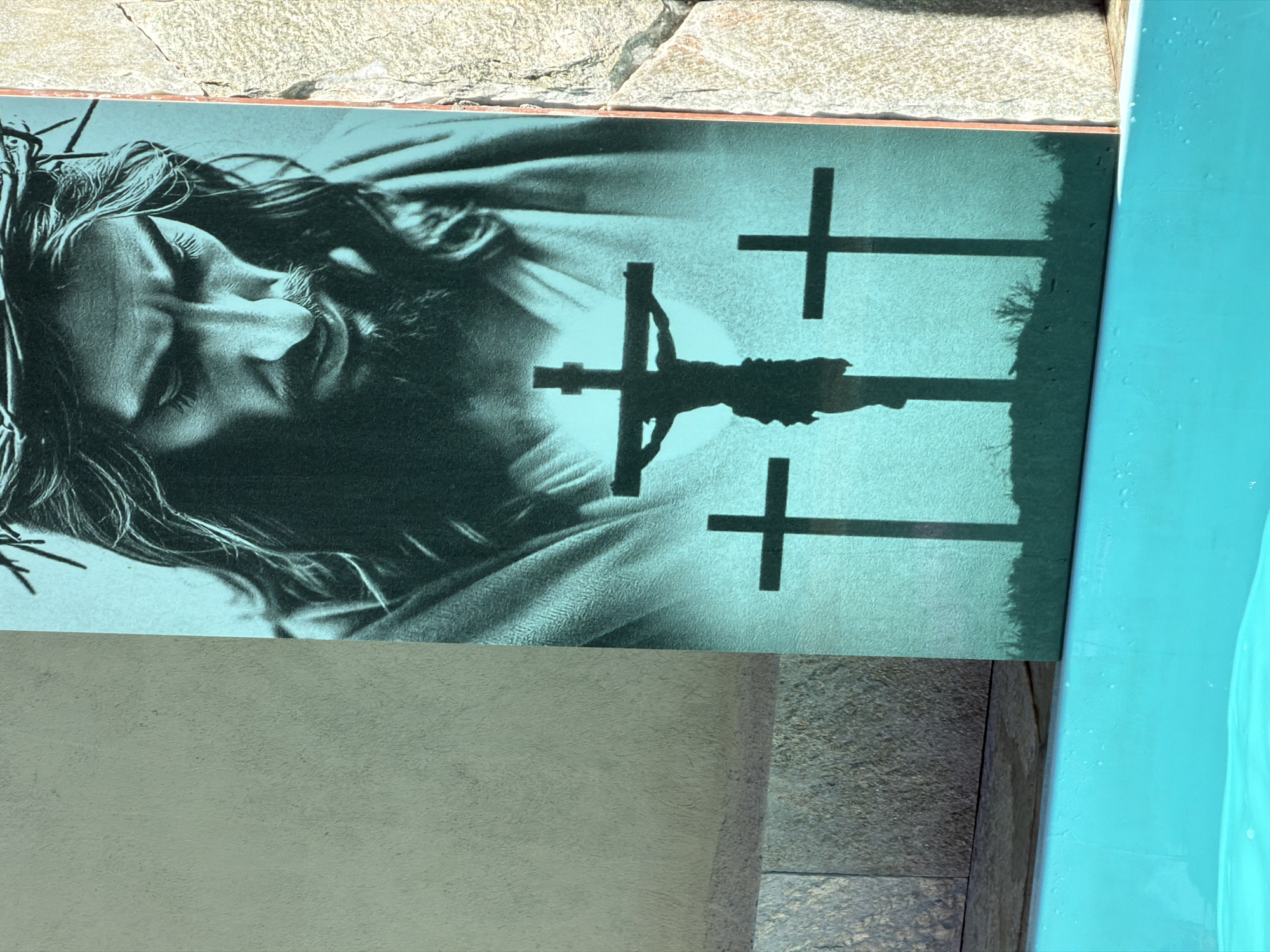 Religious artwork observed near pool facilities in Pirenópolis, Brazil