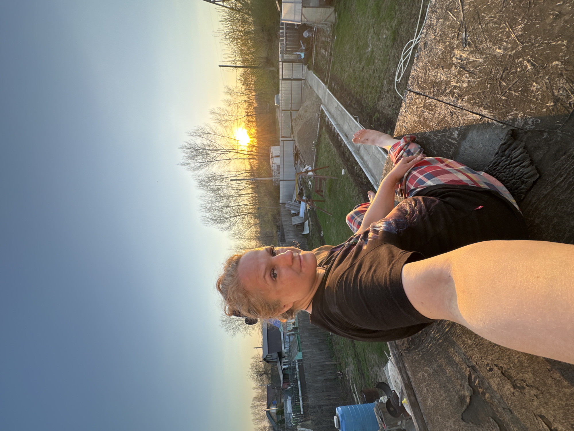 Family enjoys sunset gathering with dog in Chaikovsky, Russia