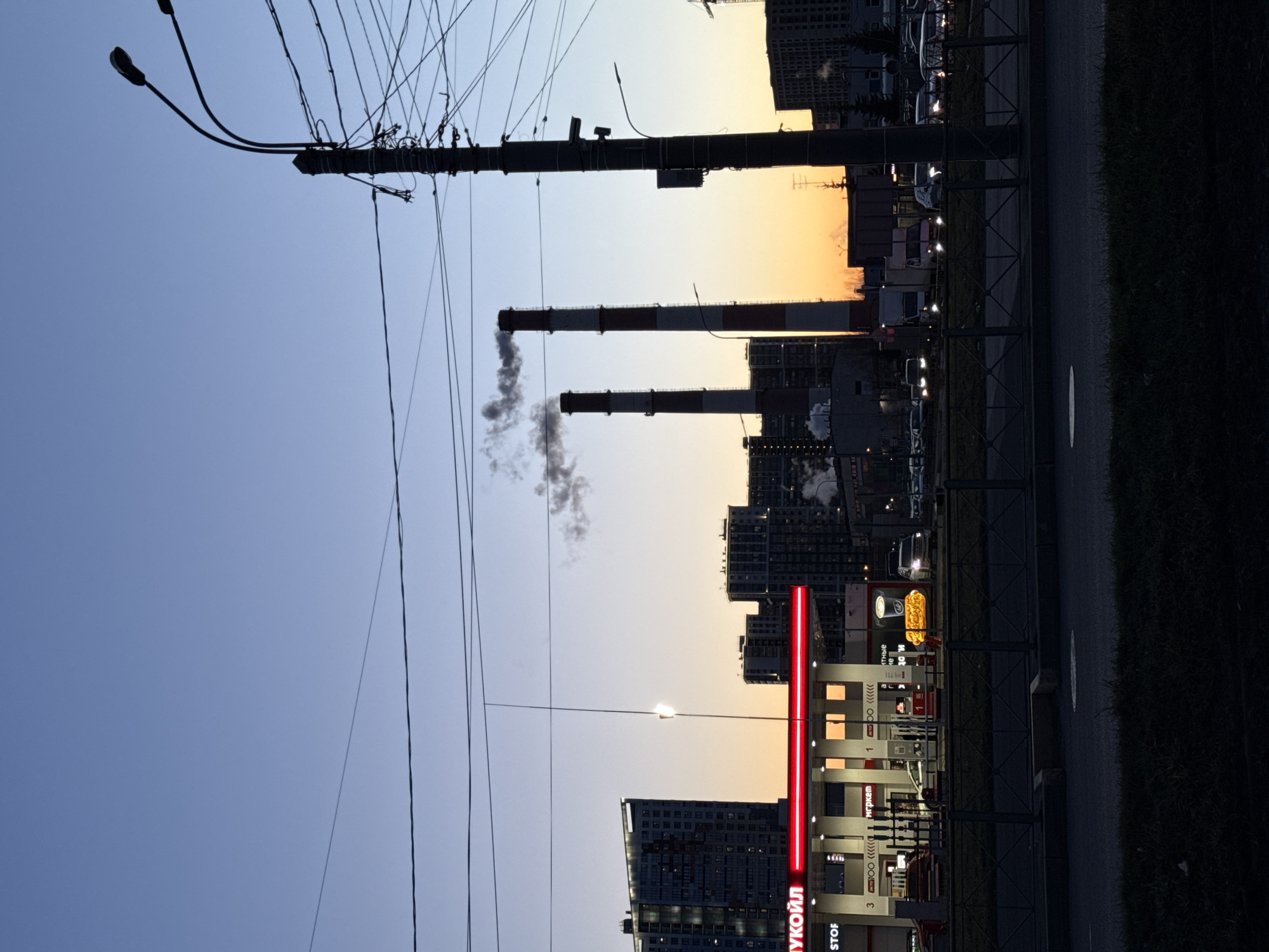 Evening street scene documented near Saint Petersburg gas station