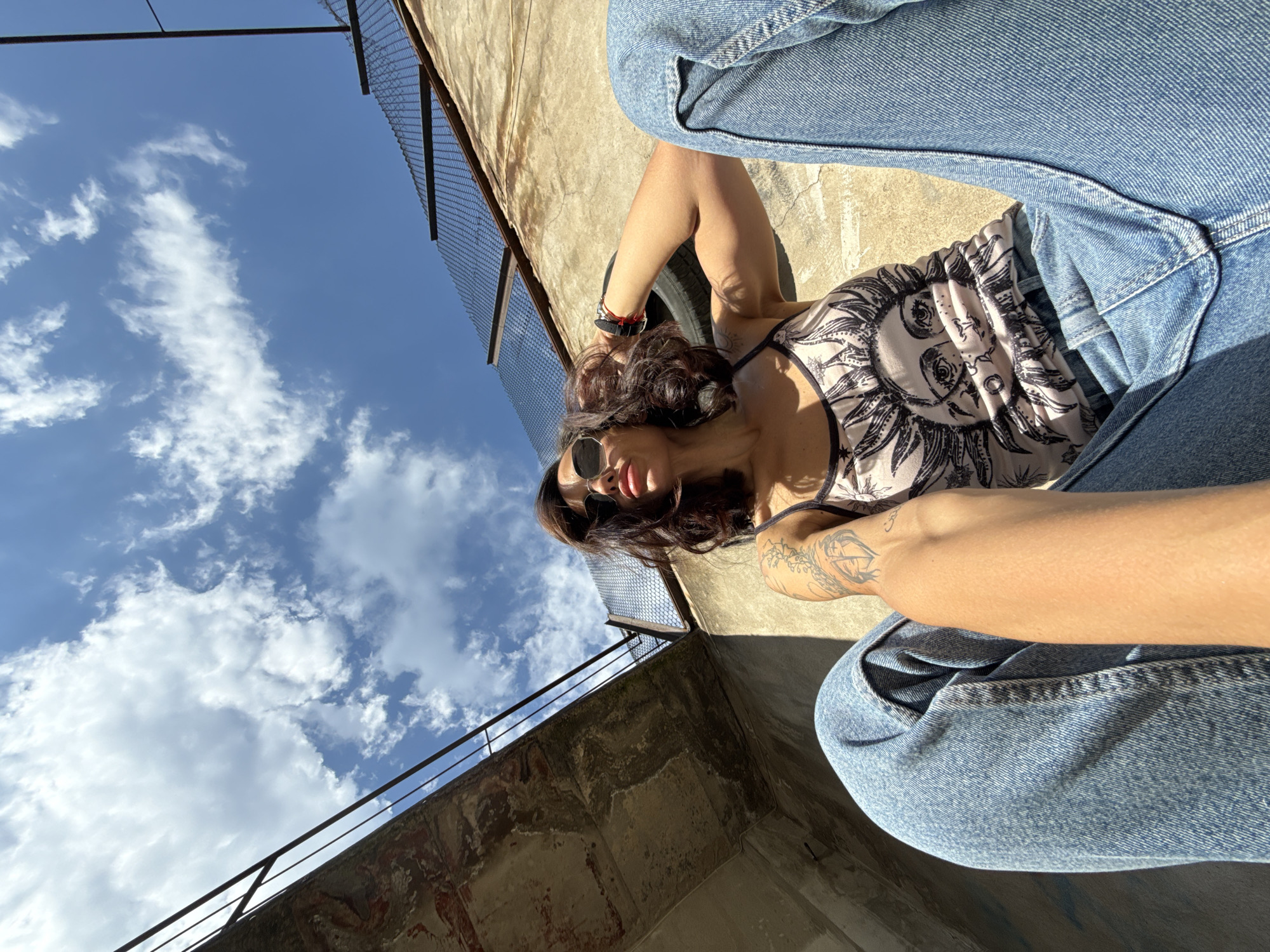 Woman enjoys sunny afternoon outdoors in Pleven courtyard