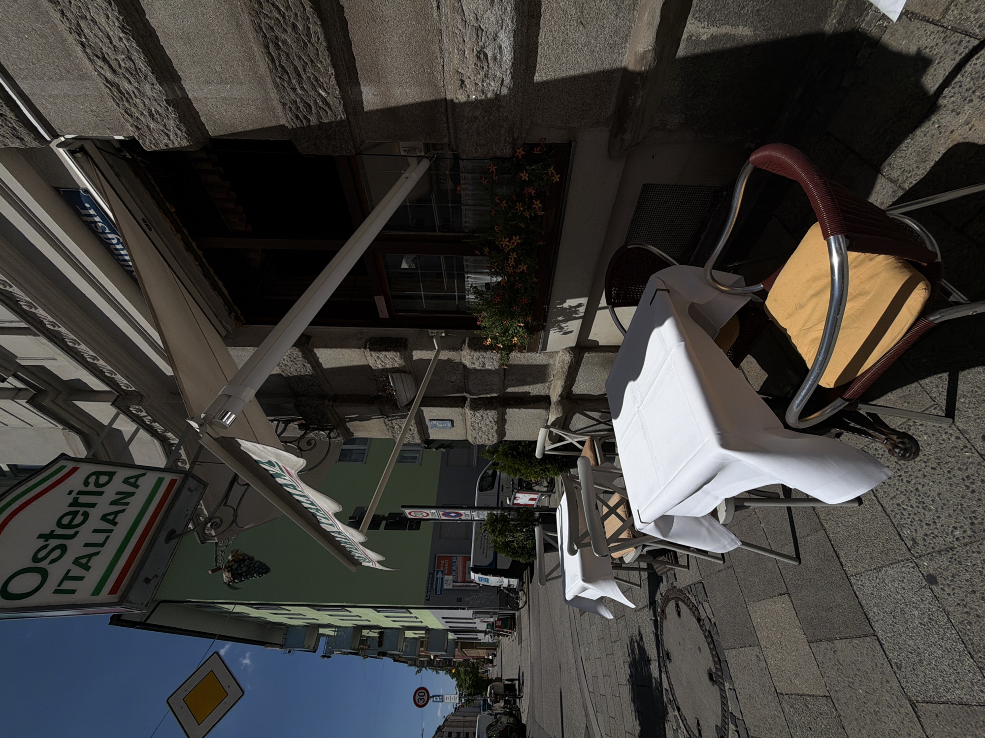 Street-level details around an Italian restaurant in Munich