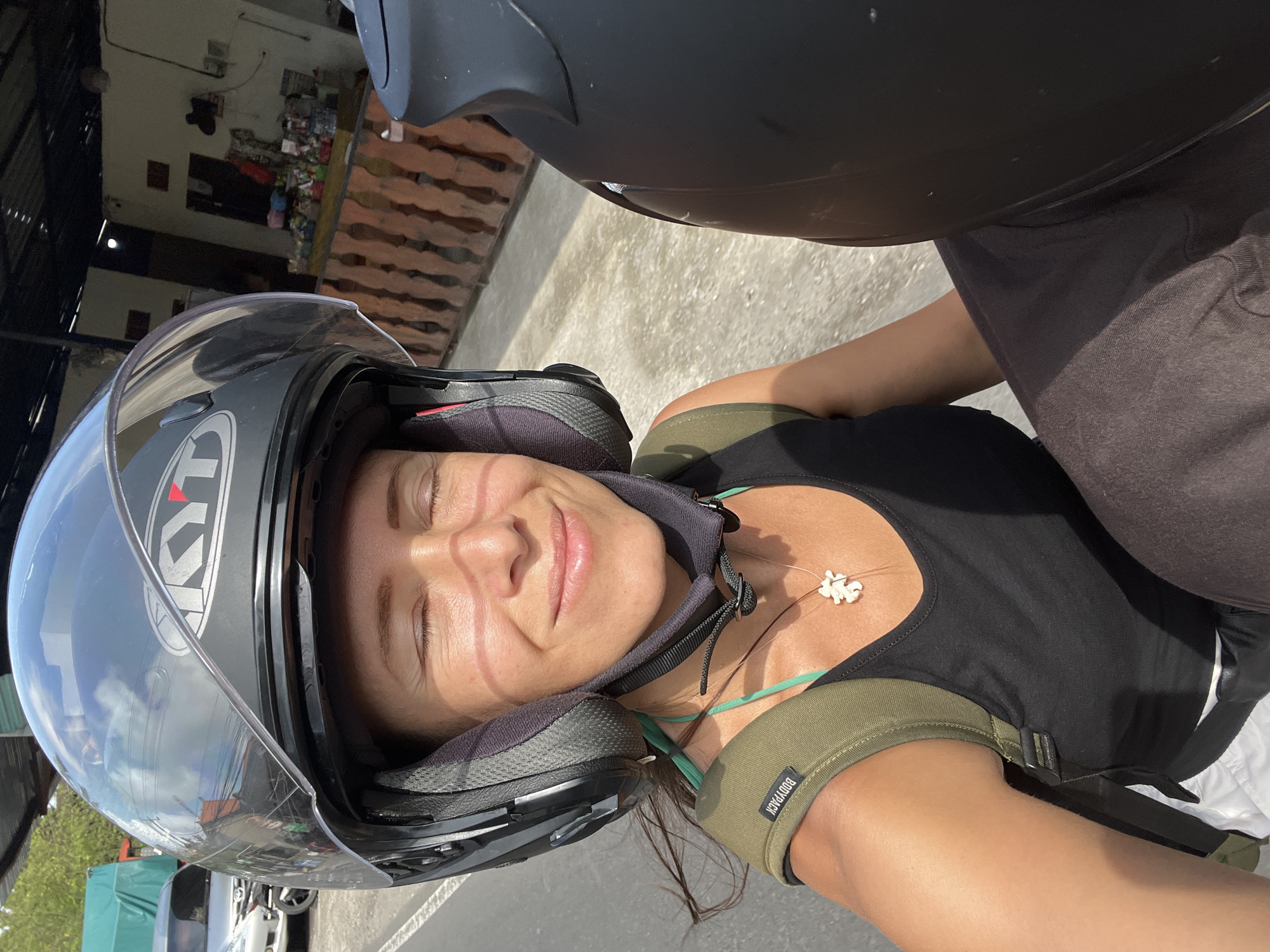 Morning scenes captured in Singakerta: motorcycle rider, stone craft shop
