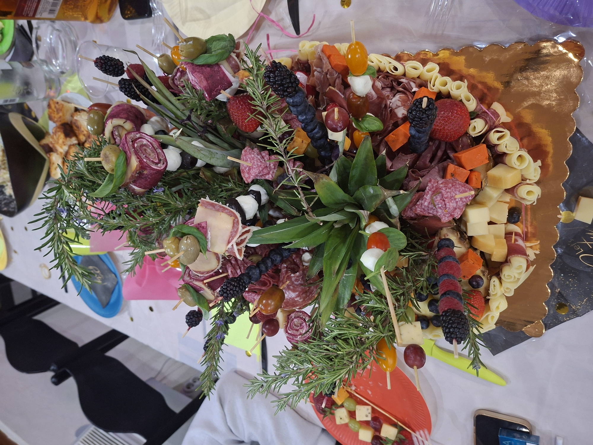 Happy hour celebration with charcuterie board documented in Gostilitsa