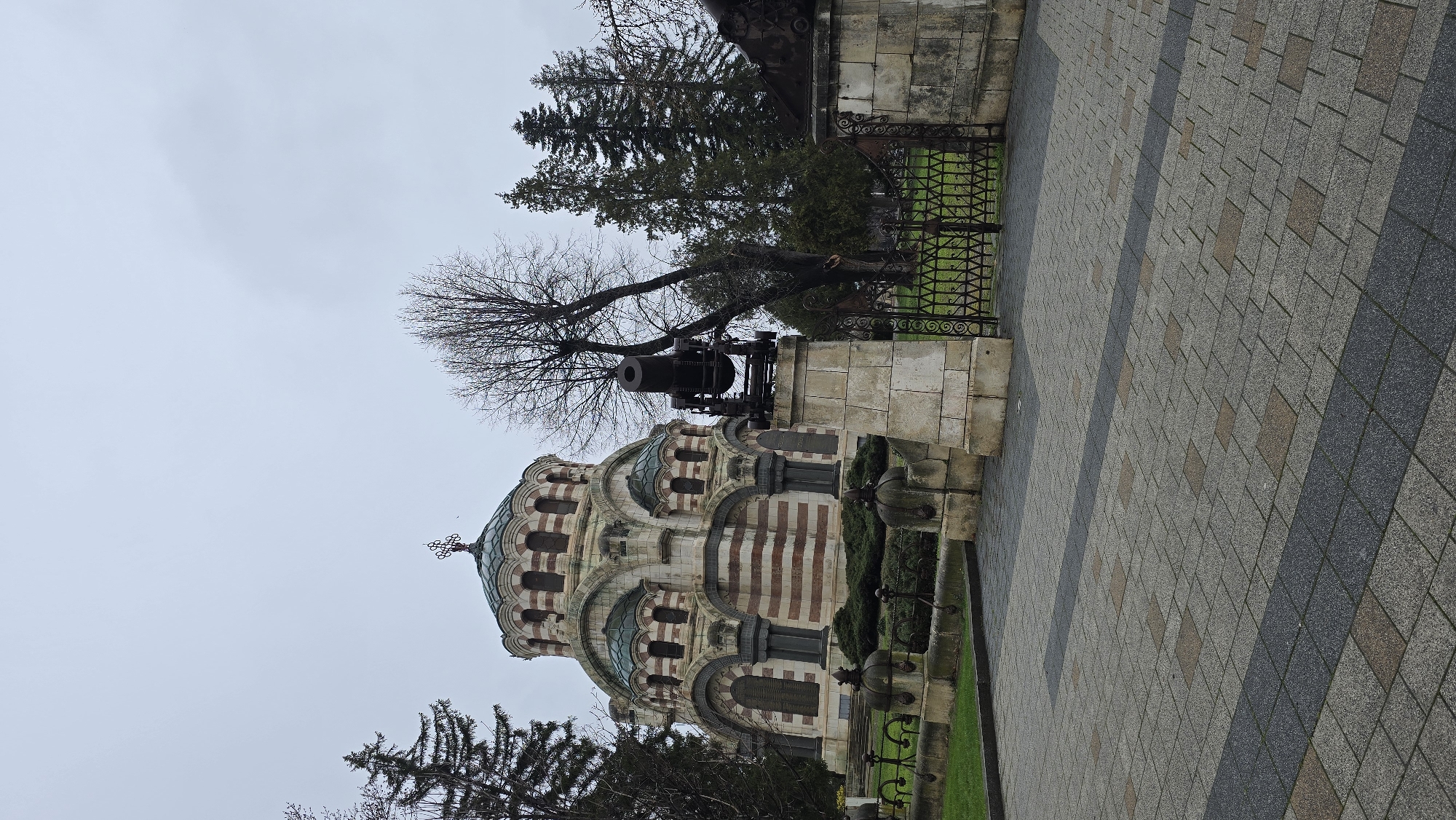 Tourist documents historical sites and spring scenery in Pleven, Bulgaria
