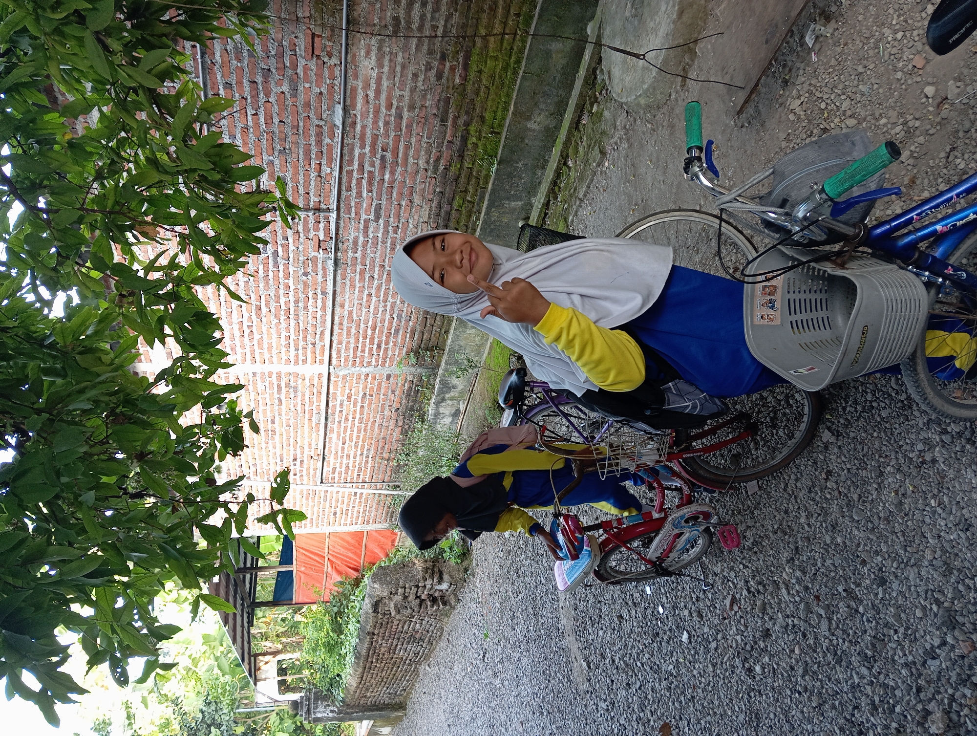 Students gather with bicycles in Baron, Indonesia