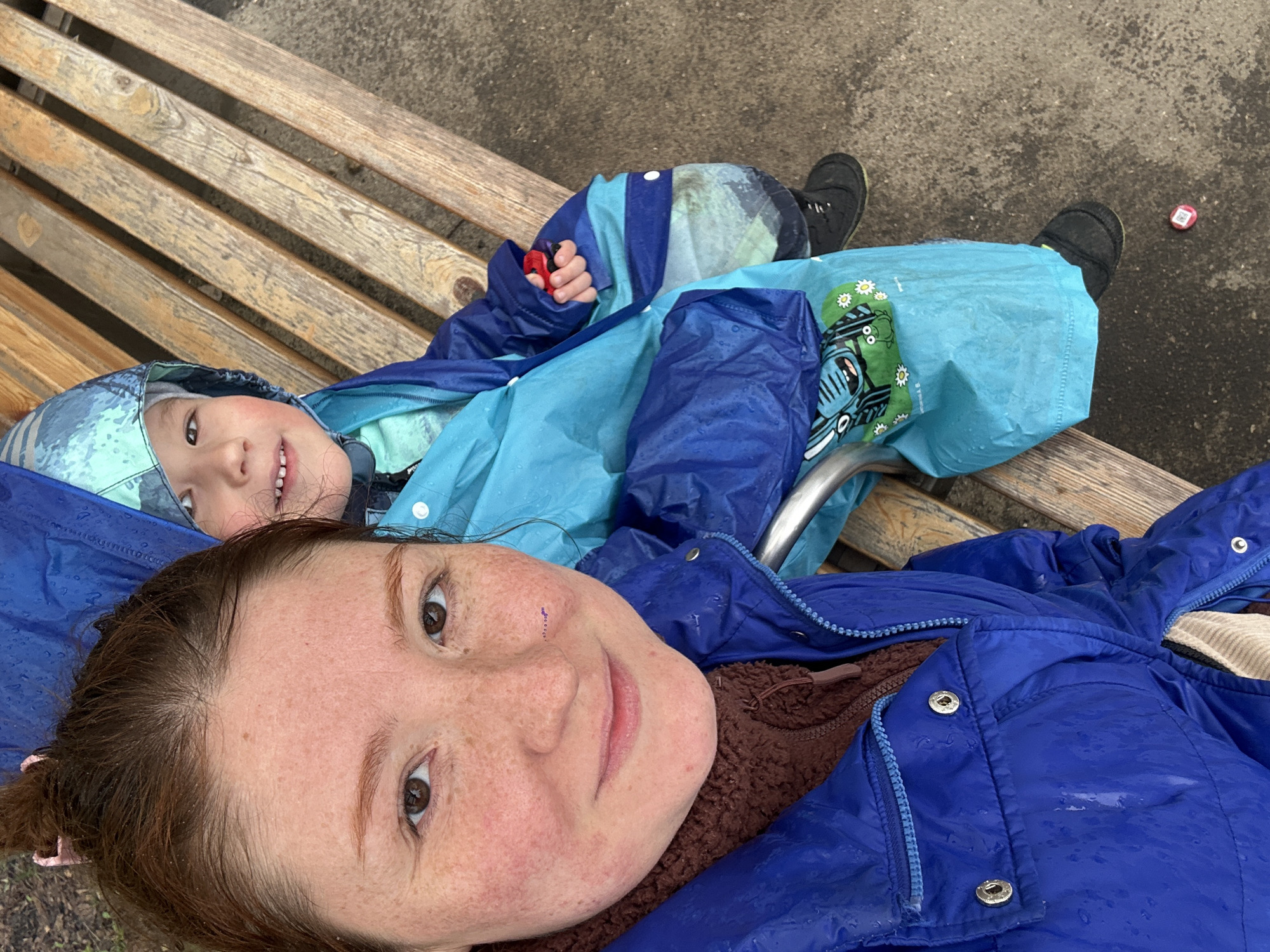 Mother and child share quiet moment on bench in Russia