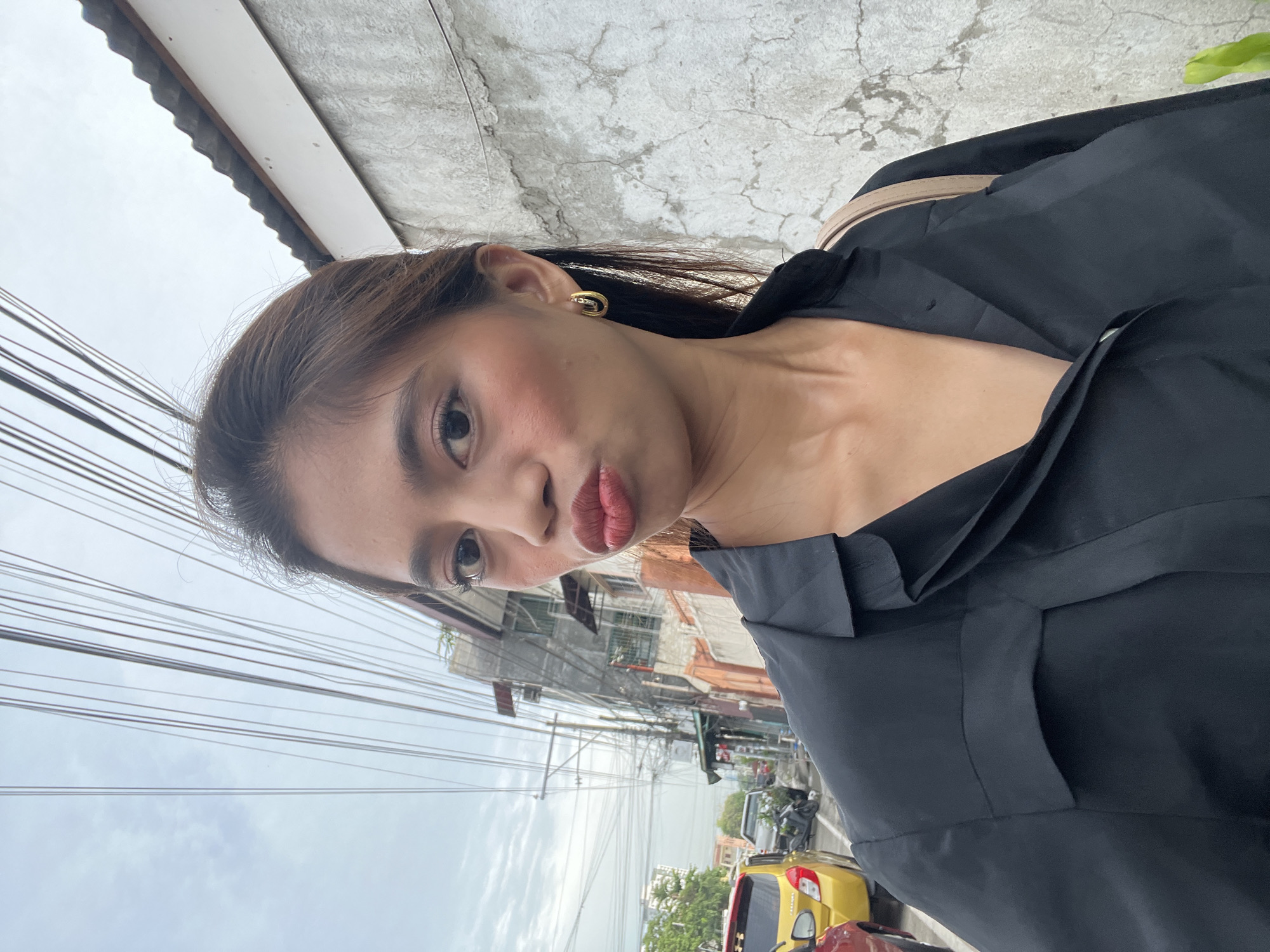 Selfie session on a Davao City street, overcast afternoon