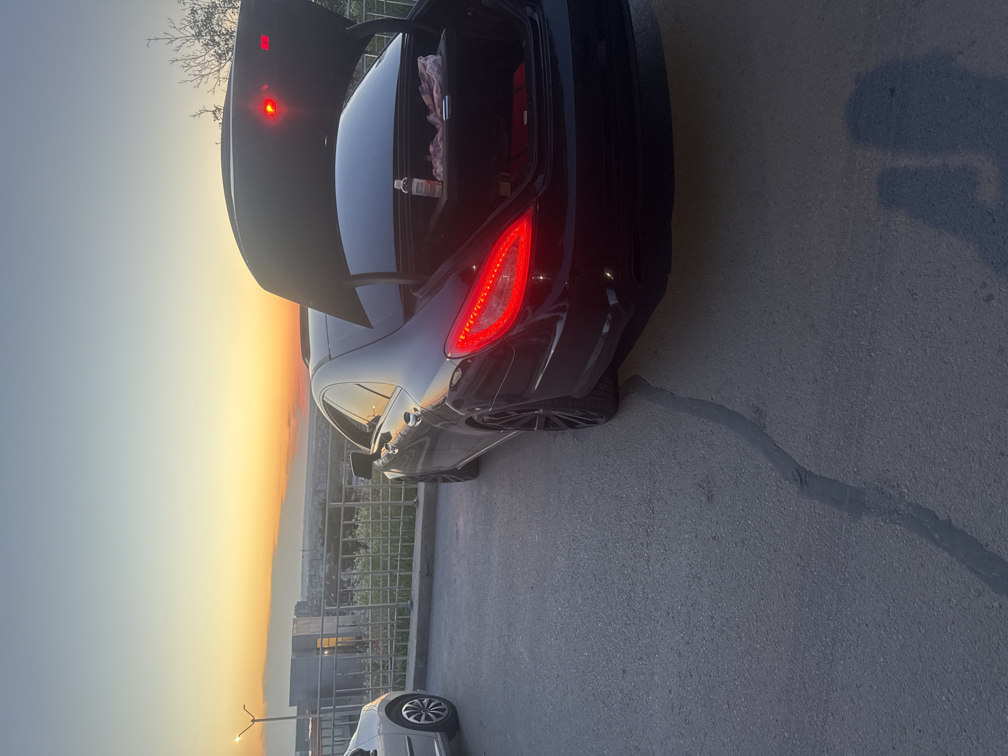 Car with open trunk spotted in Ruse during sunset