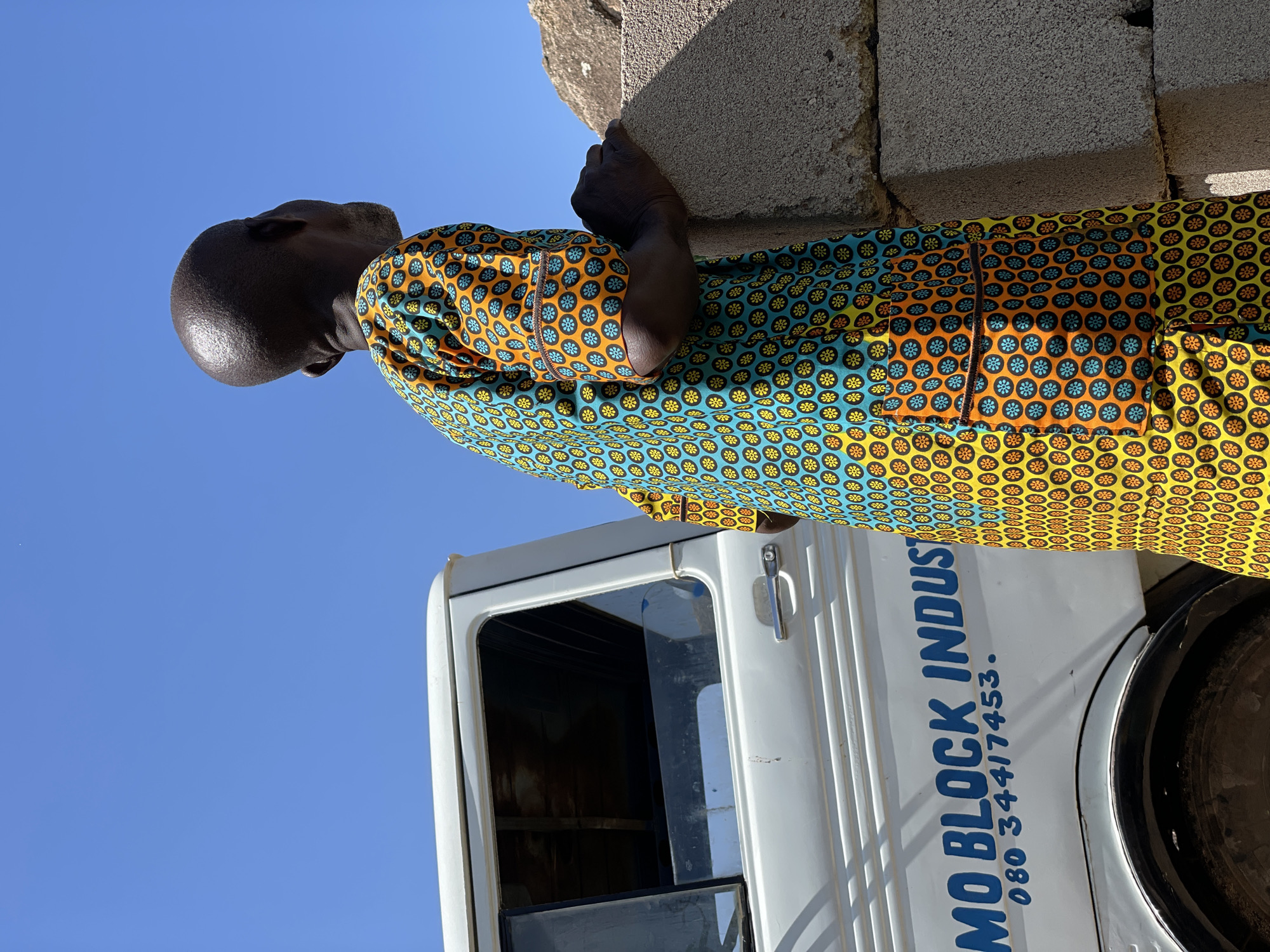 Concrete block delivery and a resting dog in Jos