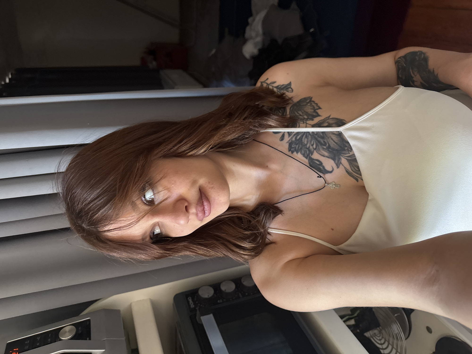 Woman takes rotated selfie indoors in Antwerp, Belgium