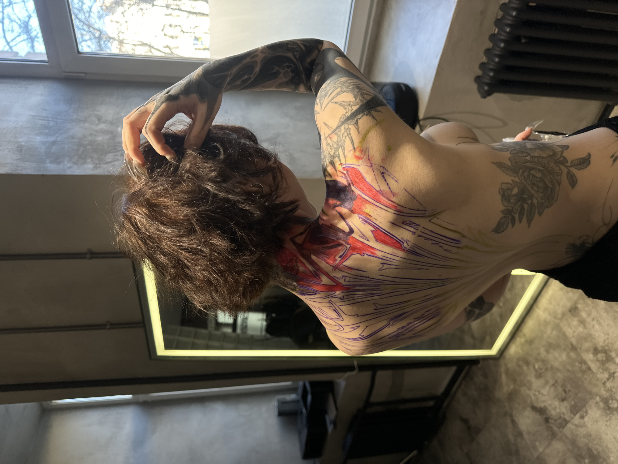 Tattoo session documented through selfies at Moscow parlor