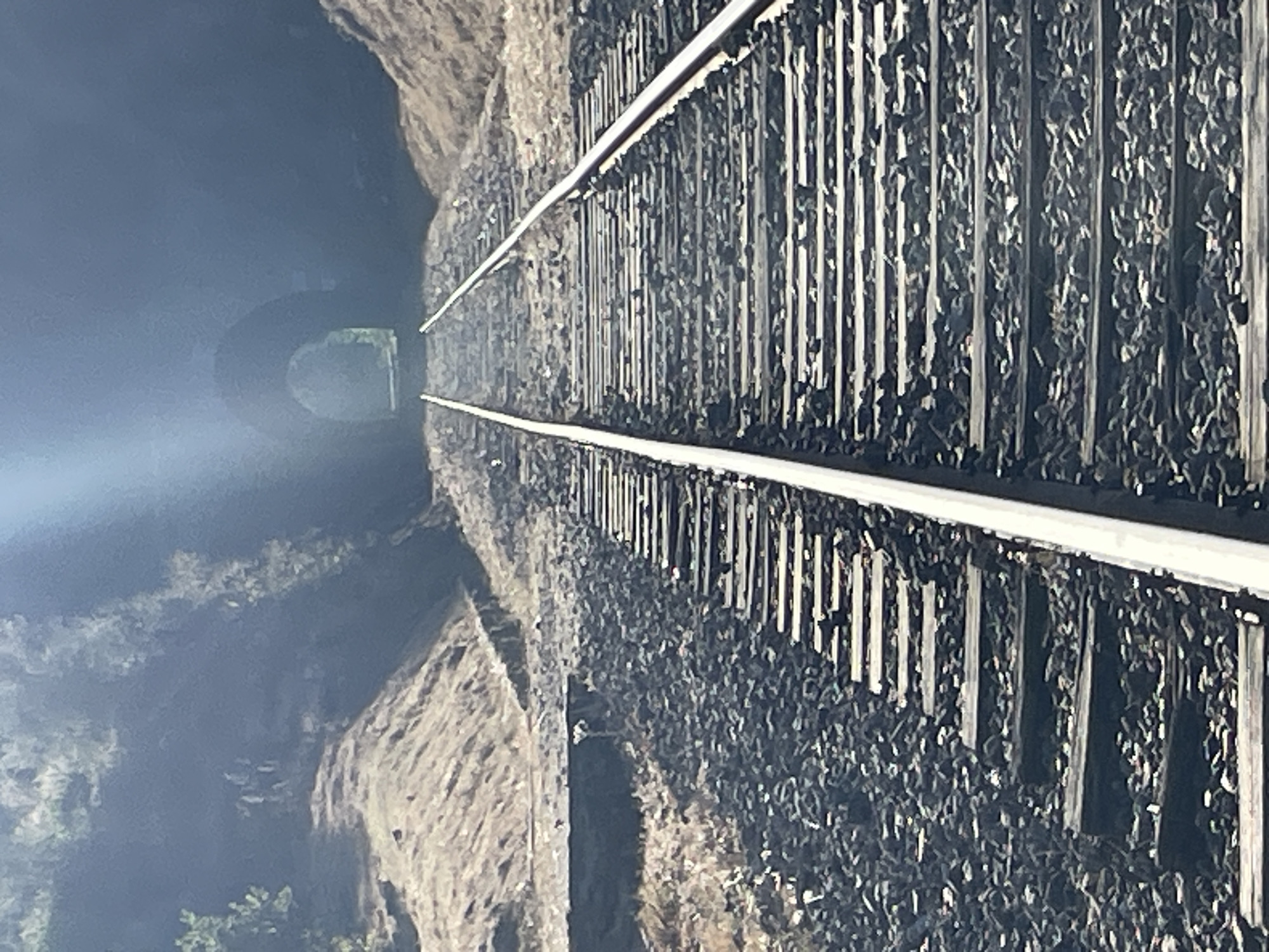 Afternoon at a mountain railway gorge with tunnels, river, and swimming