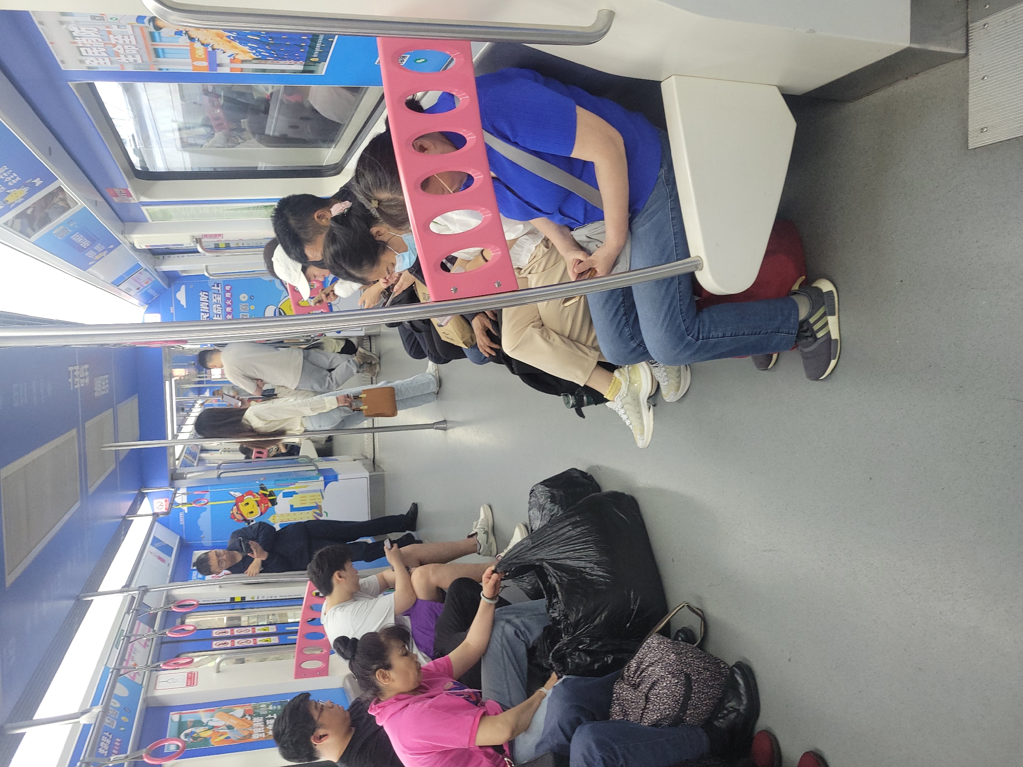 Overcrowded train car documented in Liangjiang, China