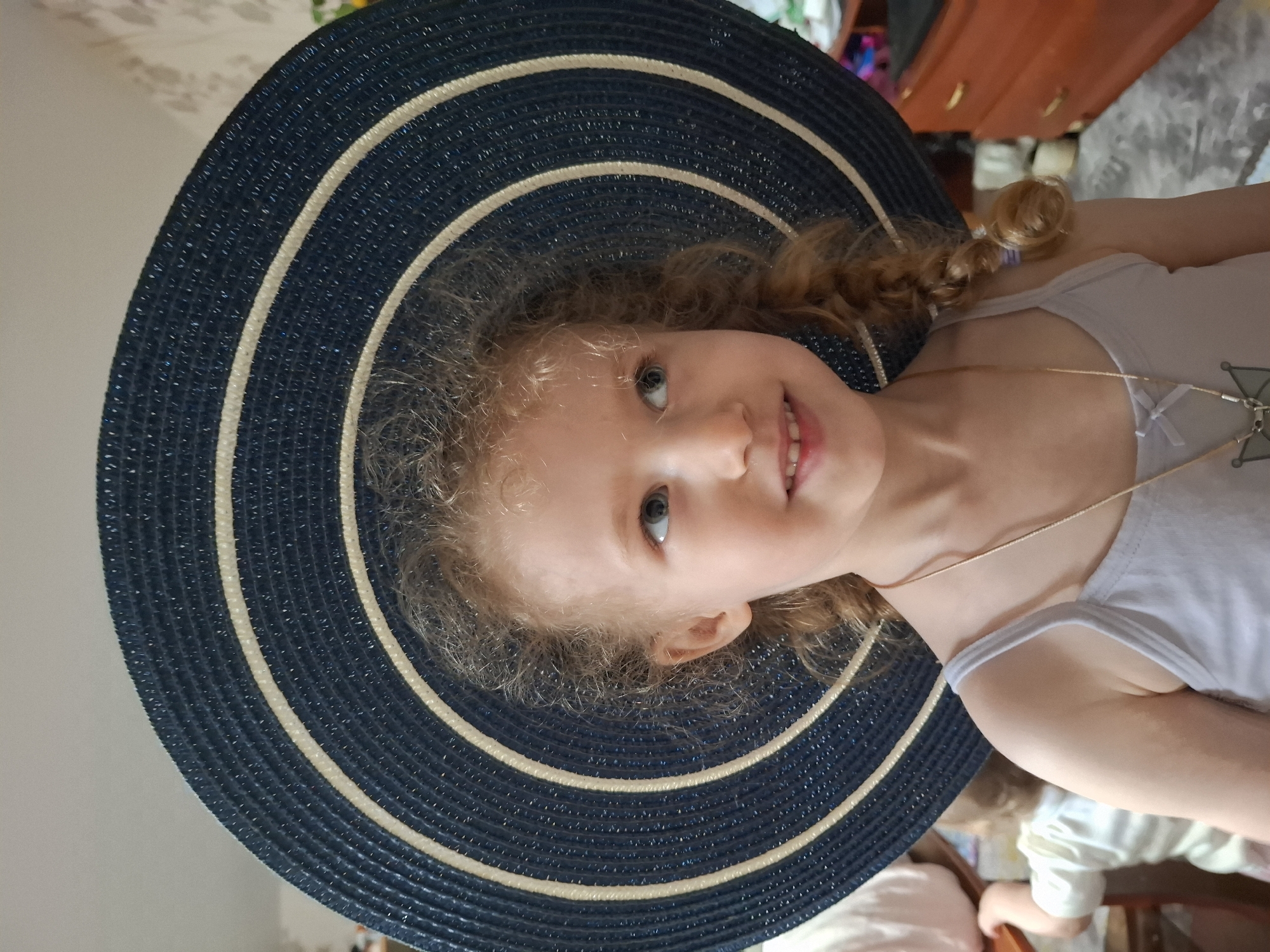 Portrait of blonde girl in navy hat captured in Russia