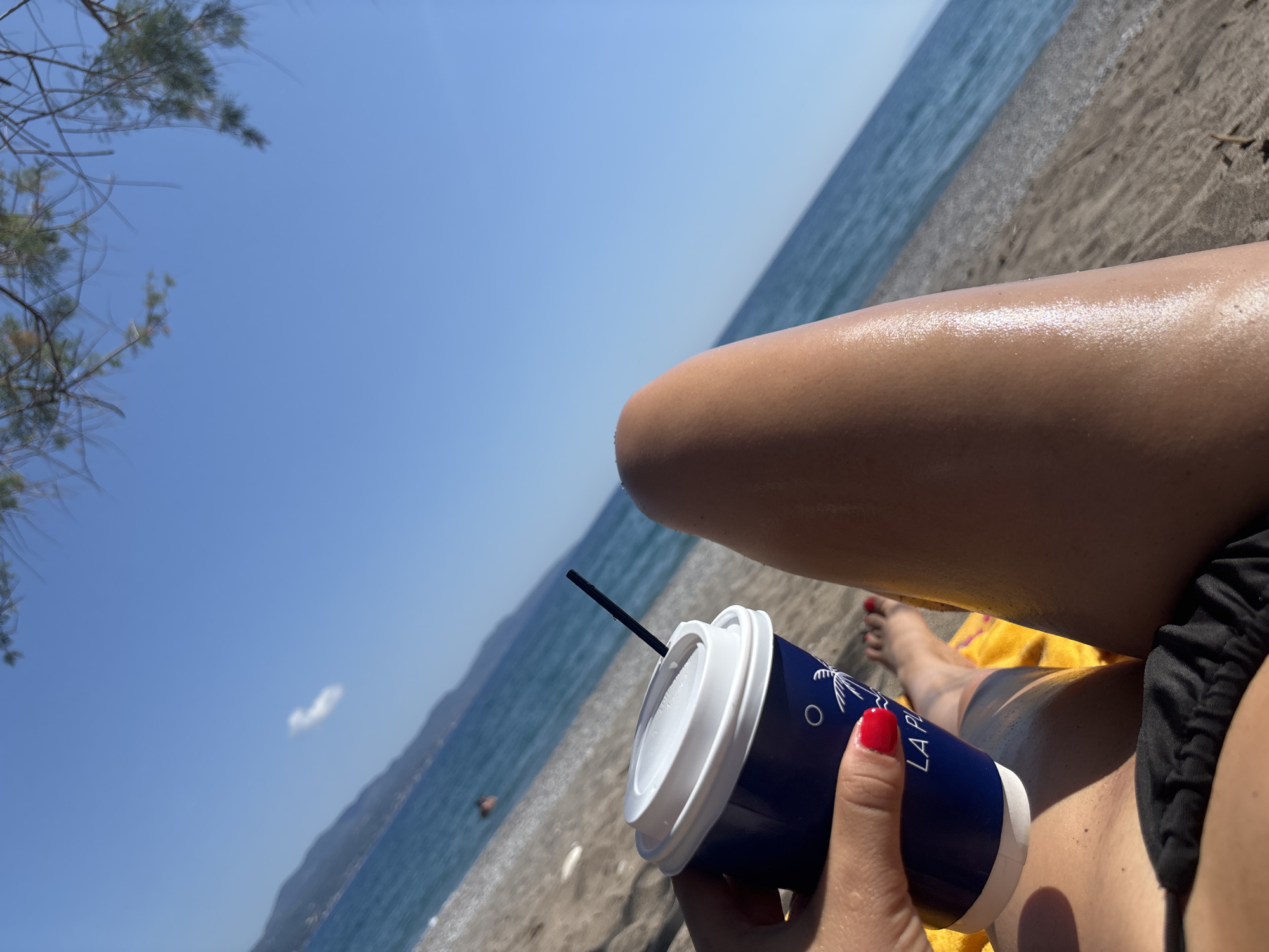 Beachgoer enjoys sunny afternoon on Kalamata shores