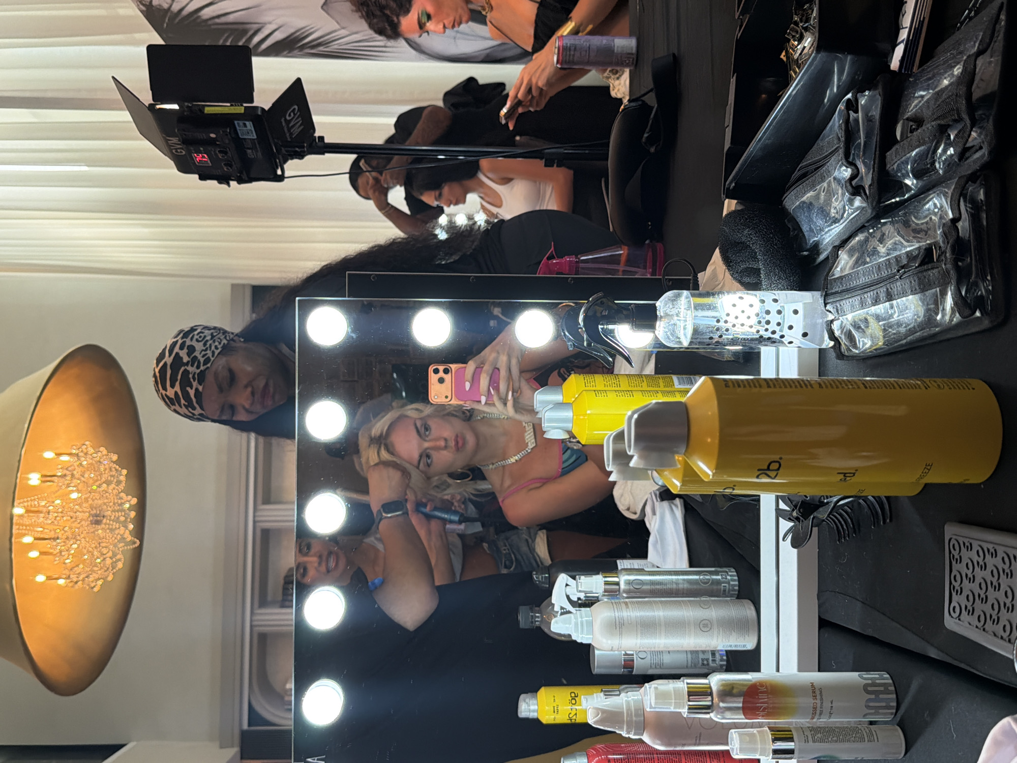 Backstage preparations captured at Miami Swim Week event