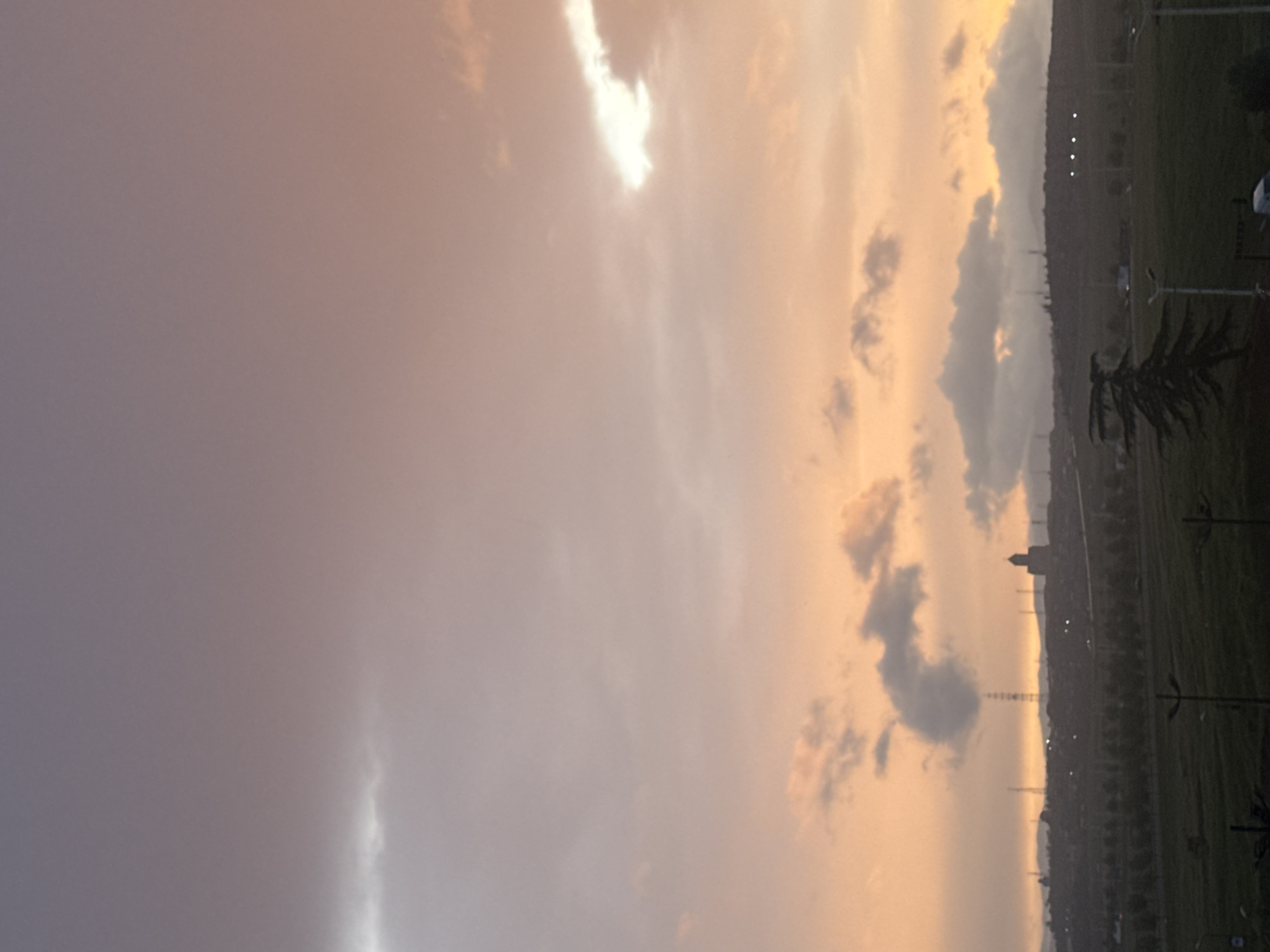Colorful sky gradient observed over Tbilisi cityscape