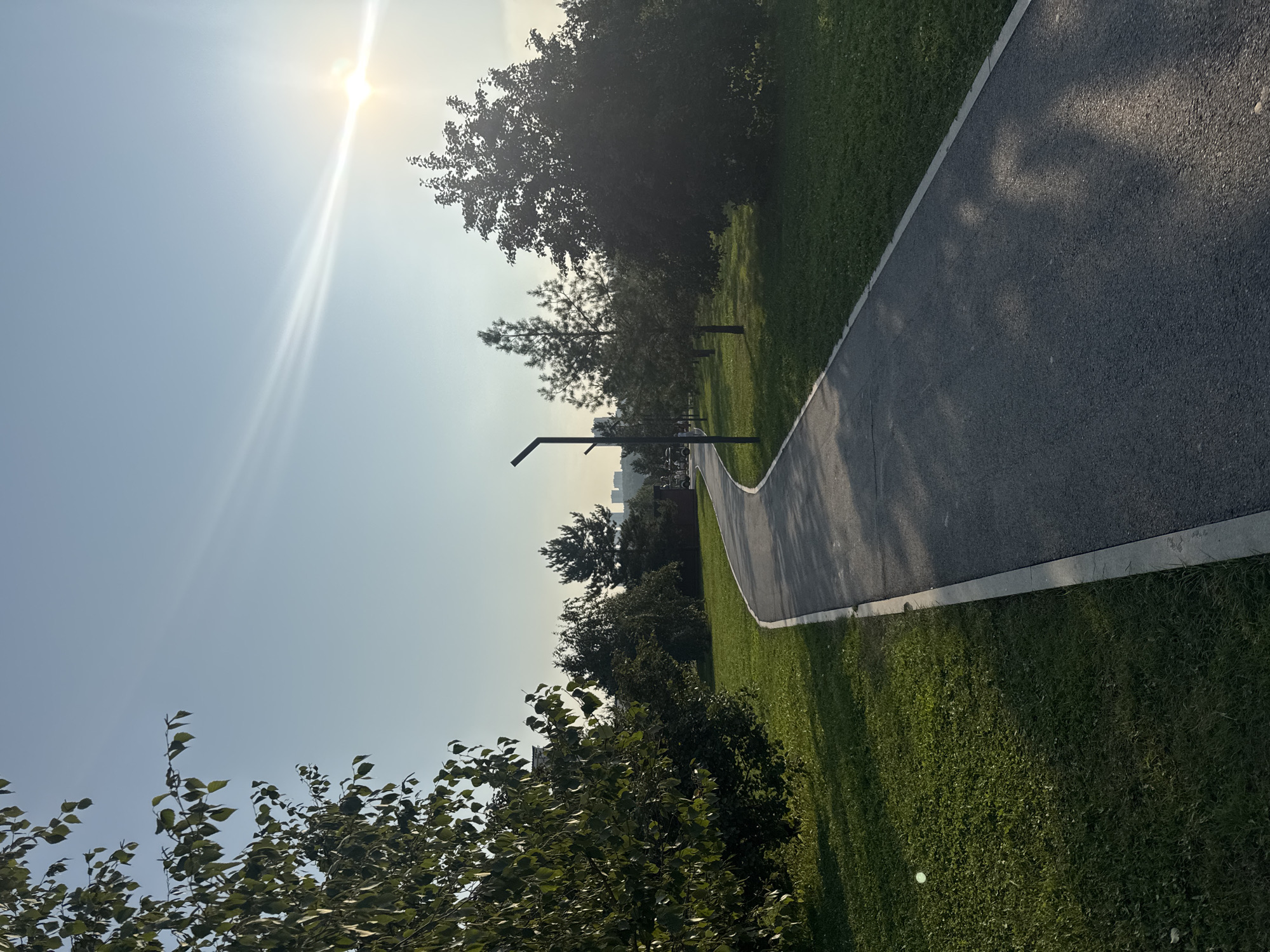 Sunny stroll through a green urban park in Ufa