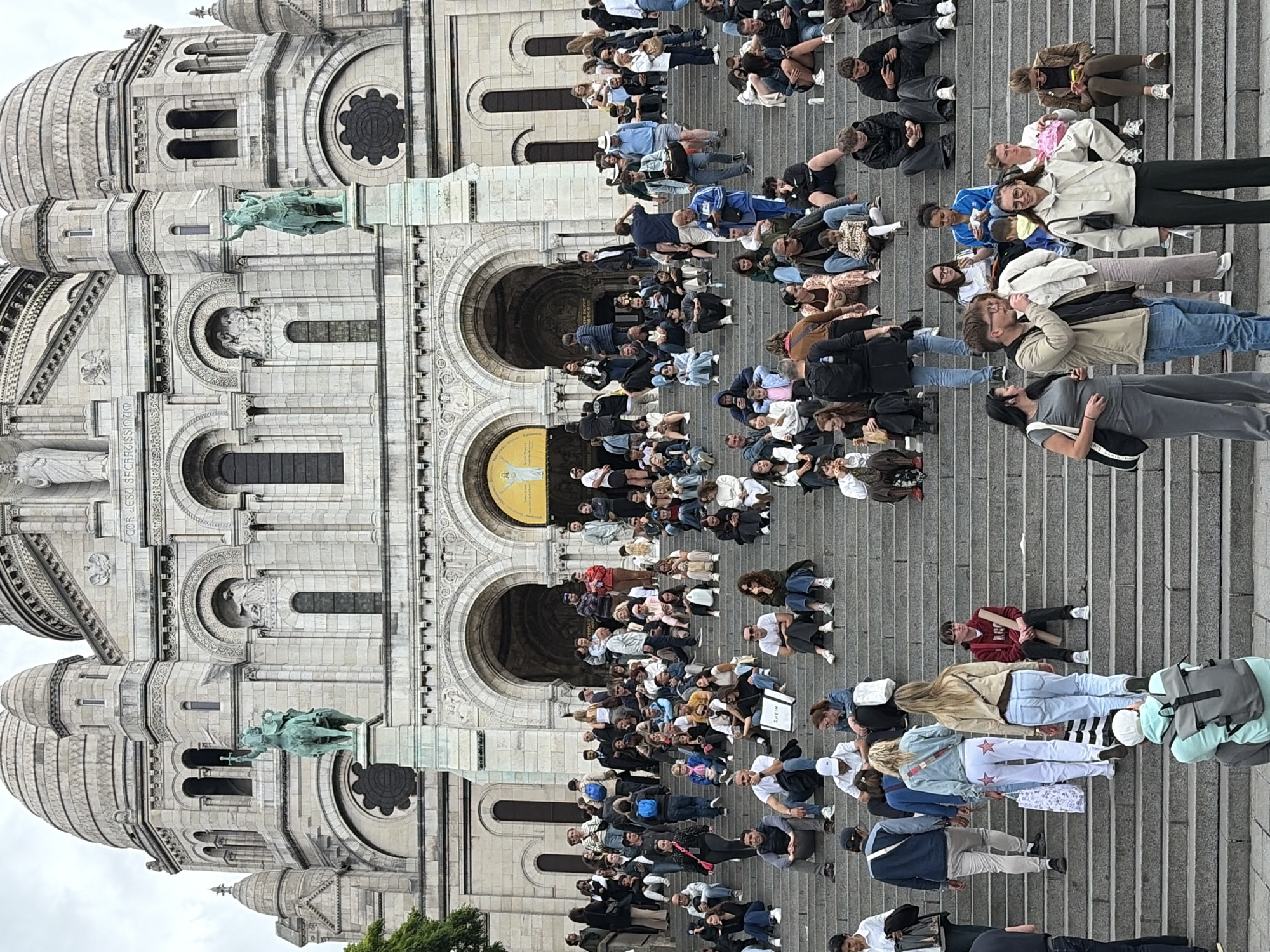 Afternoon crowds gather at Sacré-Cœur Basilica in Paris