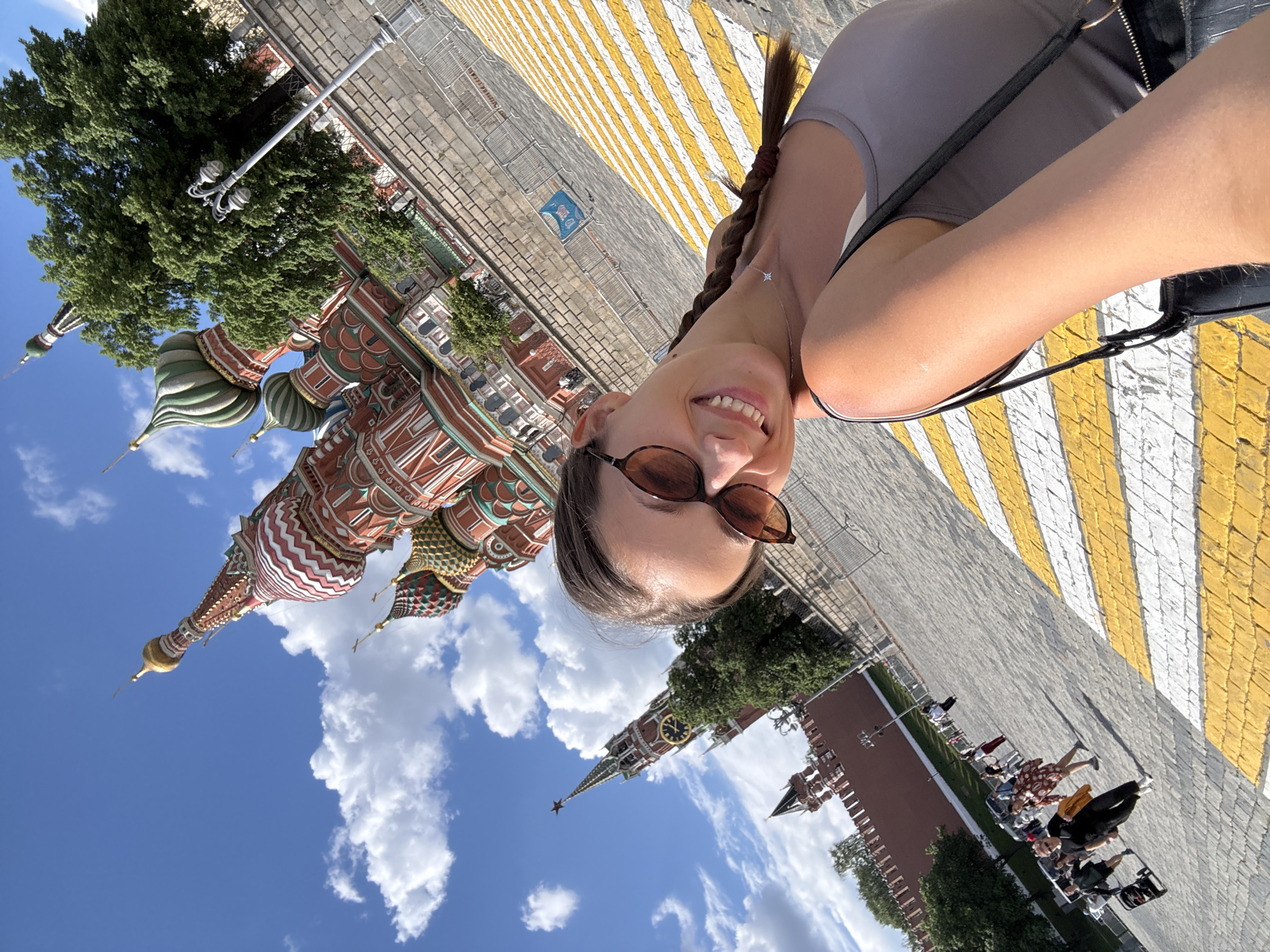 Woman creates selfie content at Red Square's St. Basil's Cathedral