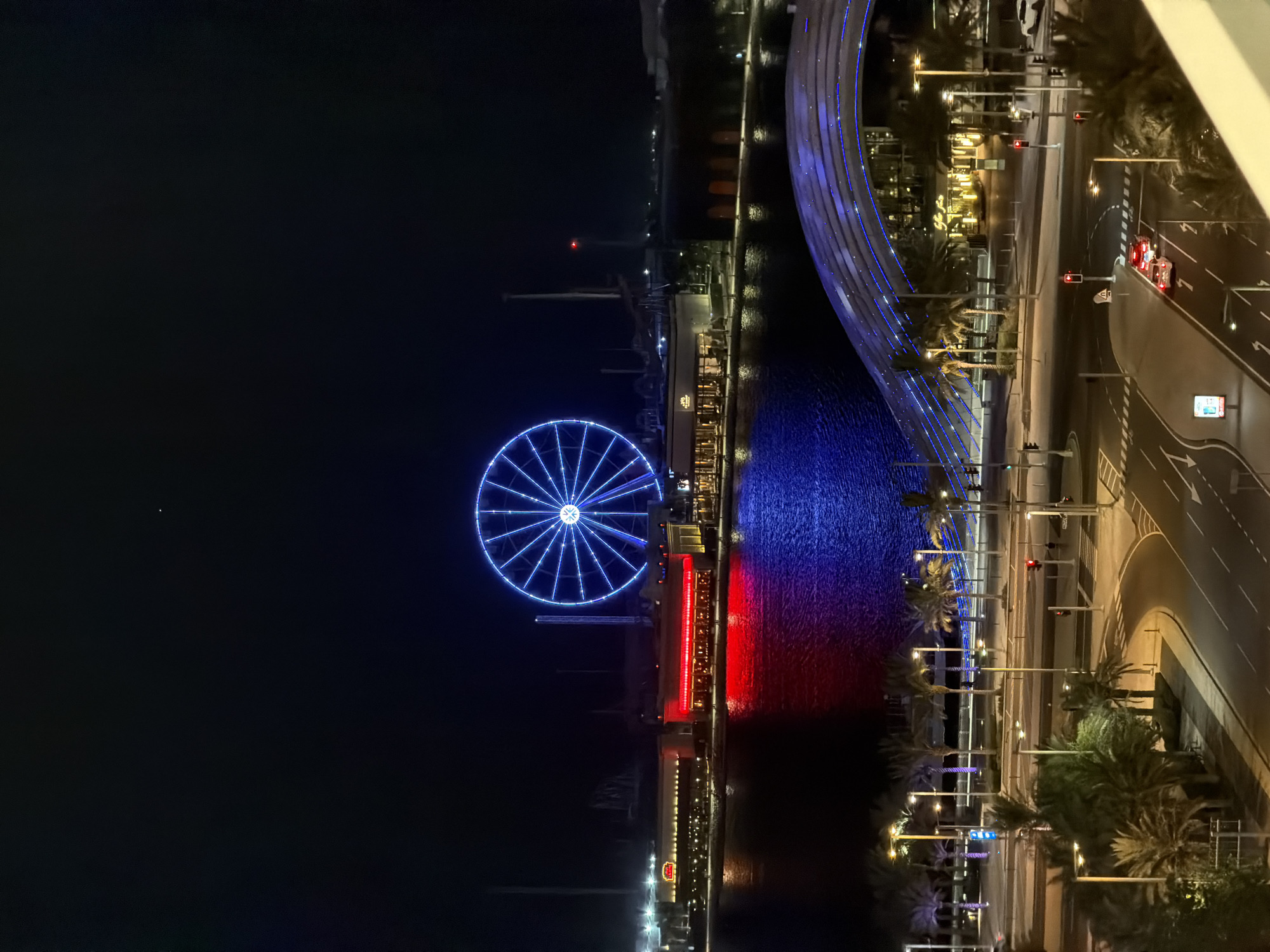 Nighttime scenes of illuminated Lusail waterfront captured from above