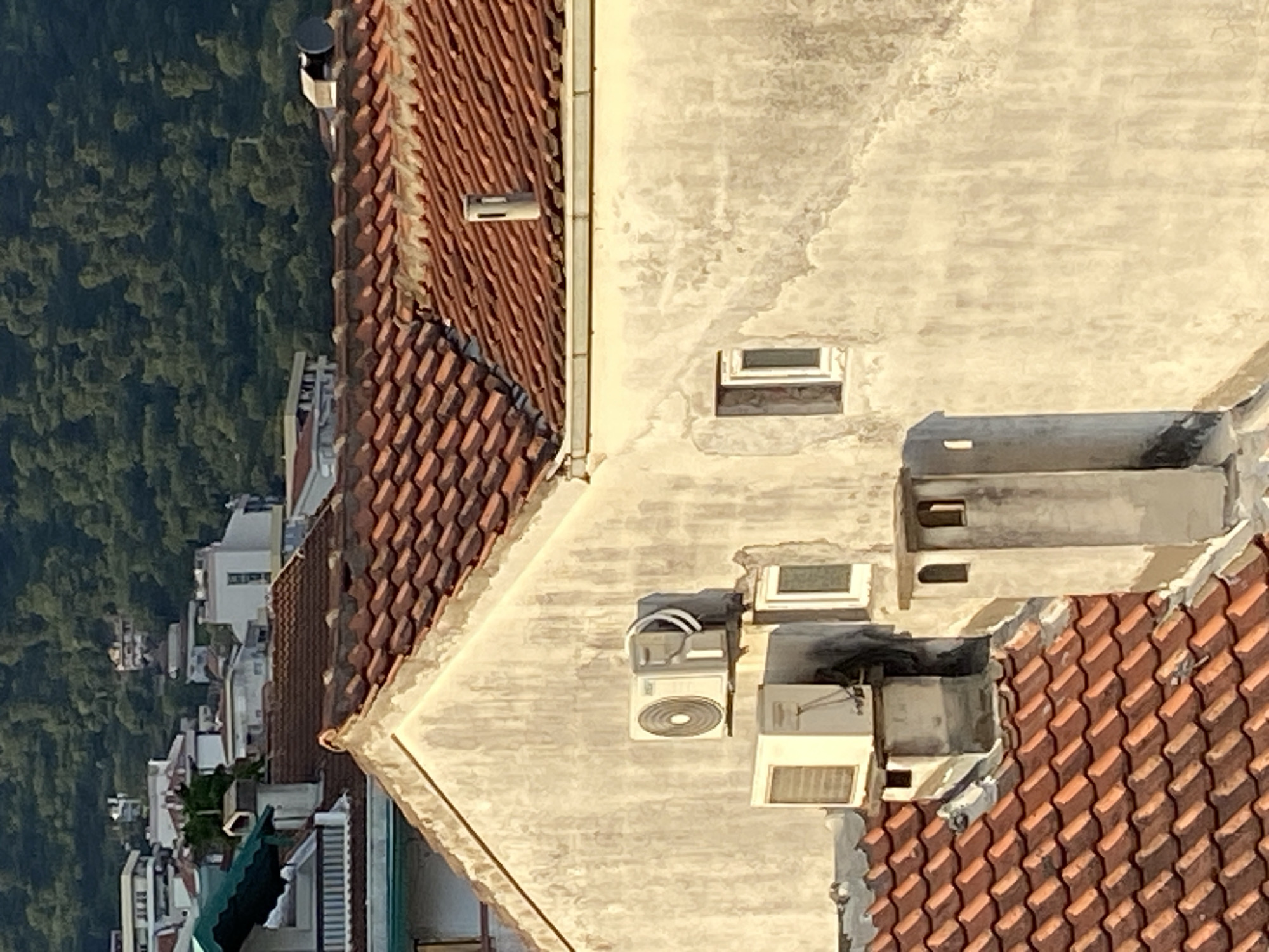 Aerial documentation of Budva cityscape during golden hour